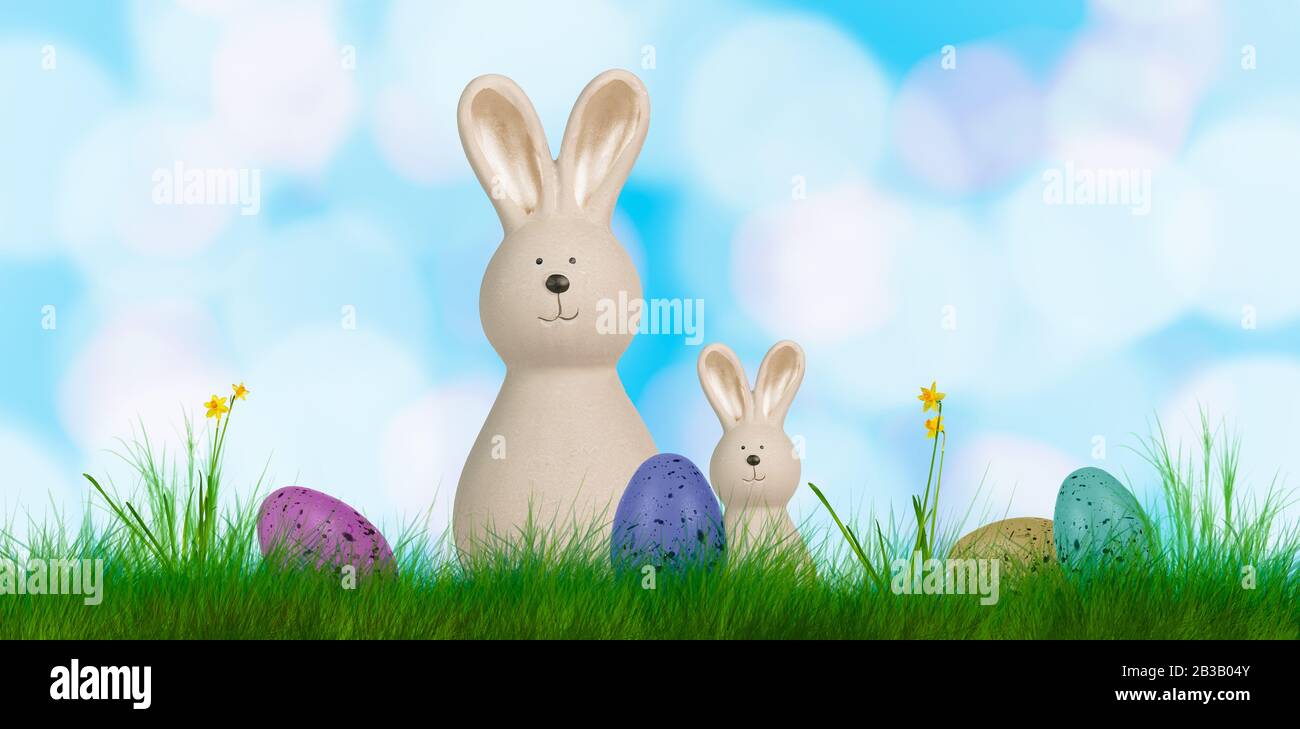 un colorato sfondo di pasqua con due coniglietti e uova di pasqua Foto Stock