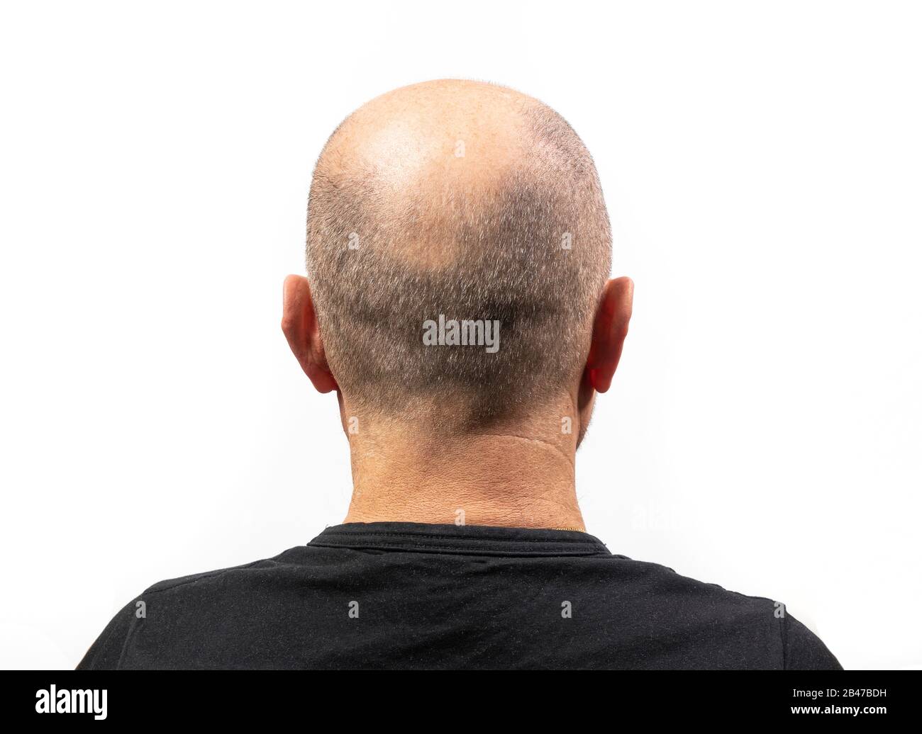 Un uomo di mezza età si girò dalla schiena con la sua T-shirt Foto Stock
