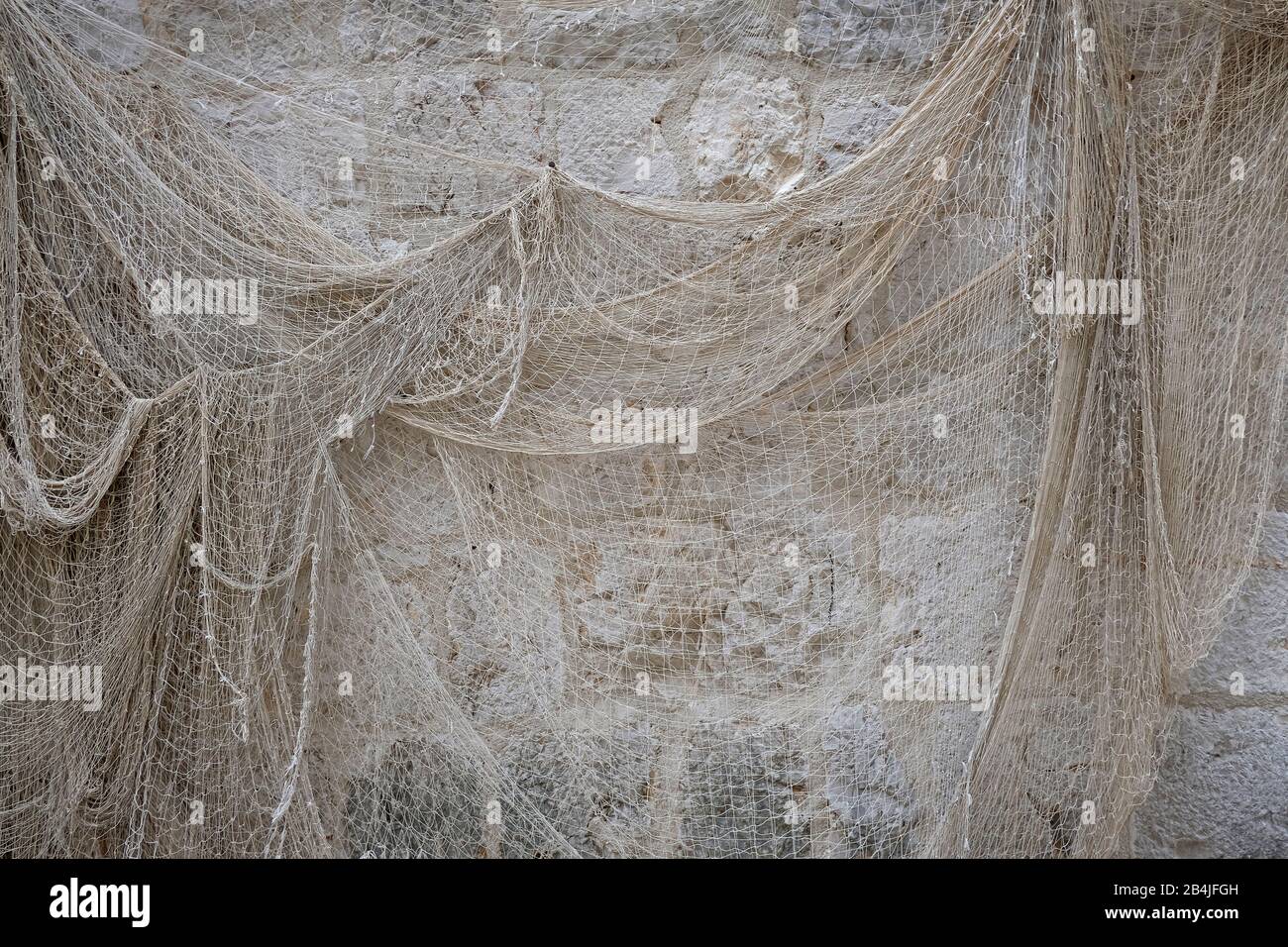 Europa, Mediterraneo, Adriatico, Croazia, Hvar, Stari Grad, rete da pesca su un muro Foto Stock