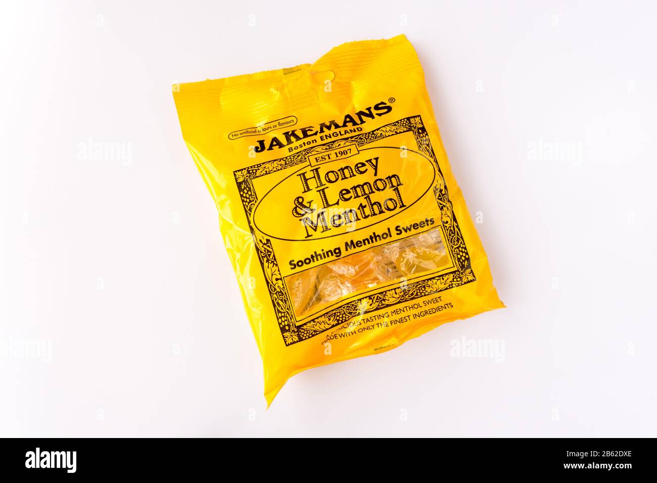 Confezione di miele di Jakemans e dolci al mentolo lenitivi al limone Foto Stock