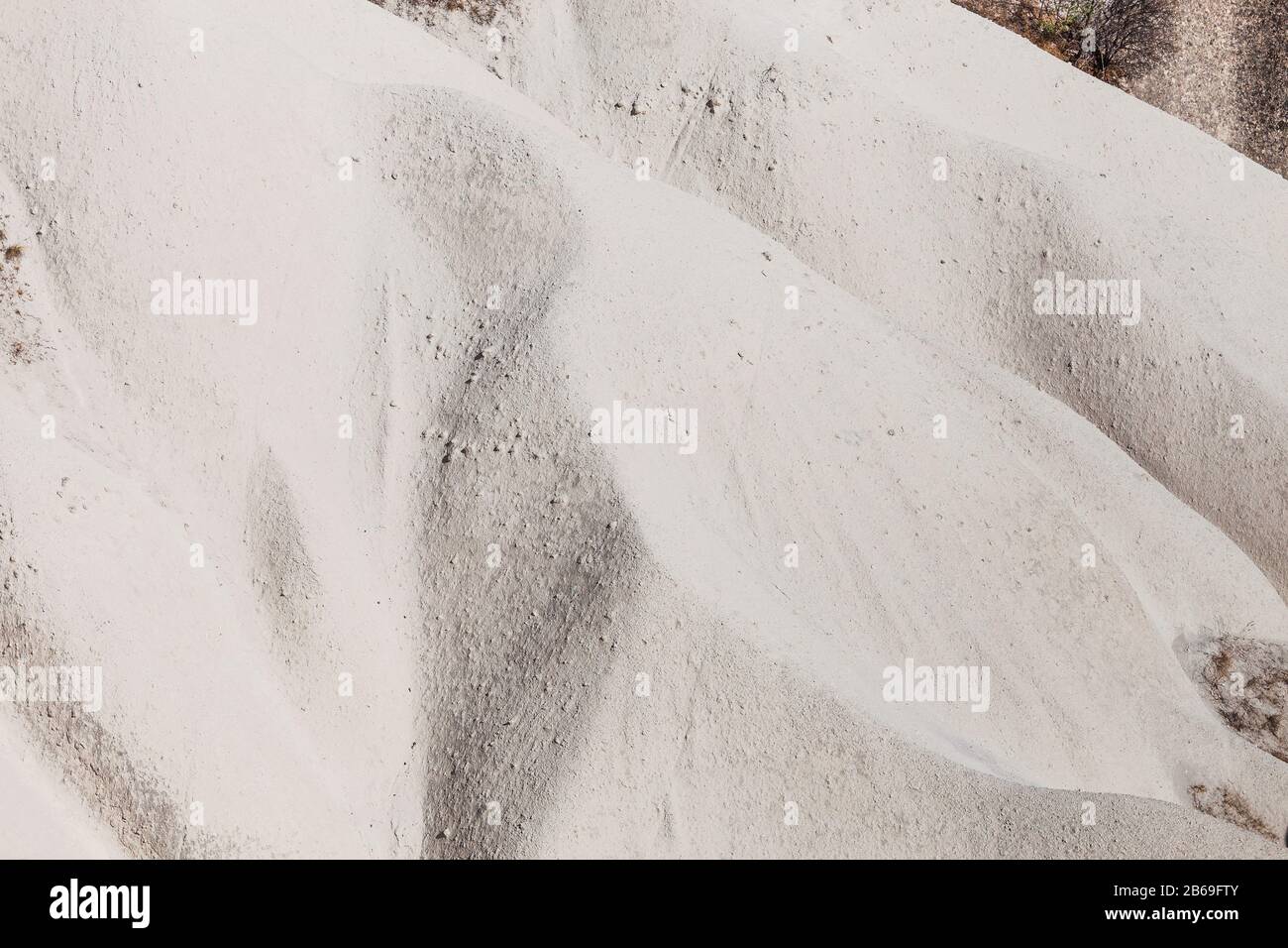 Bianche onde di tufo vulcanico closeup sfondo astratto da Cappadocia, Turchia Foto Stock