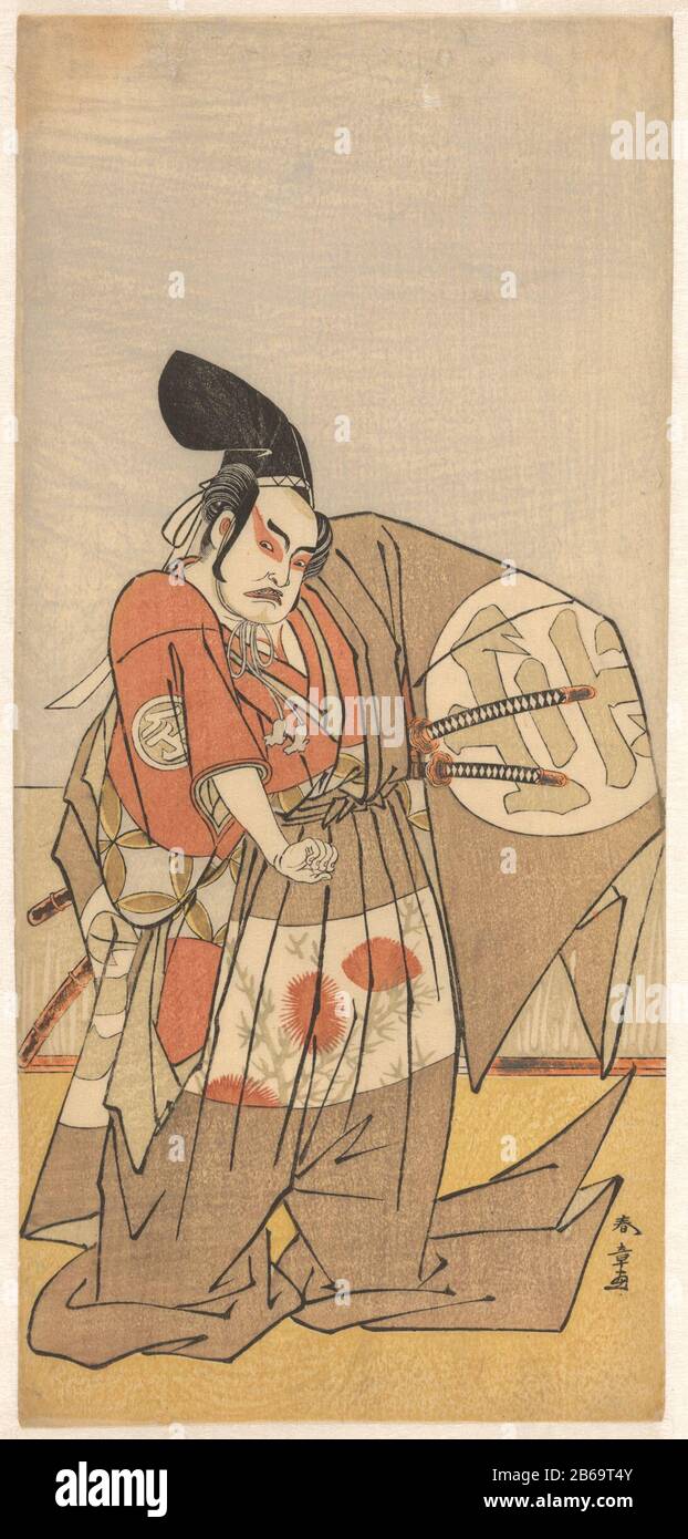 Attore nel ruolo di maligno messaggero imperiale Kabuki acteur Nakamura Sukegorô II inde rol van een boosaardige boodschapper van de keizer. Hij è gekleed in een Ceremonieel kostuum met een lange, over de vloer slepende broek en een kenmerkende hof-hoed van zwart lak. Op het wijde bovenstuk van zijn kostuum is zijn het familiewapen; het Japanse teken 'une' groot afgebeeld. Het patroon van bloeiende distels op de kleding, en de rode schminkt rond de ogen, benadrukken zijn boosaardige karakter. Produttore : Pentmaker: Katsukawa Shunsho (vermeld op Object)Plaats manufacturing: Japan Dating: C Foto Stock