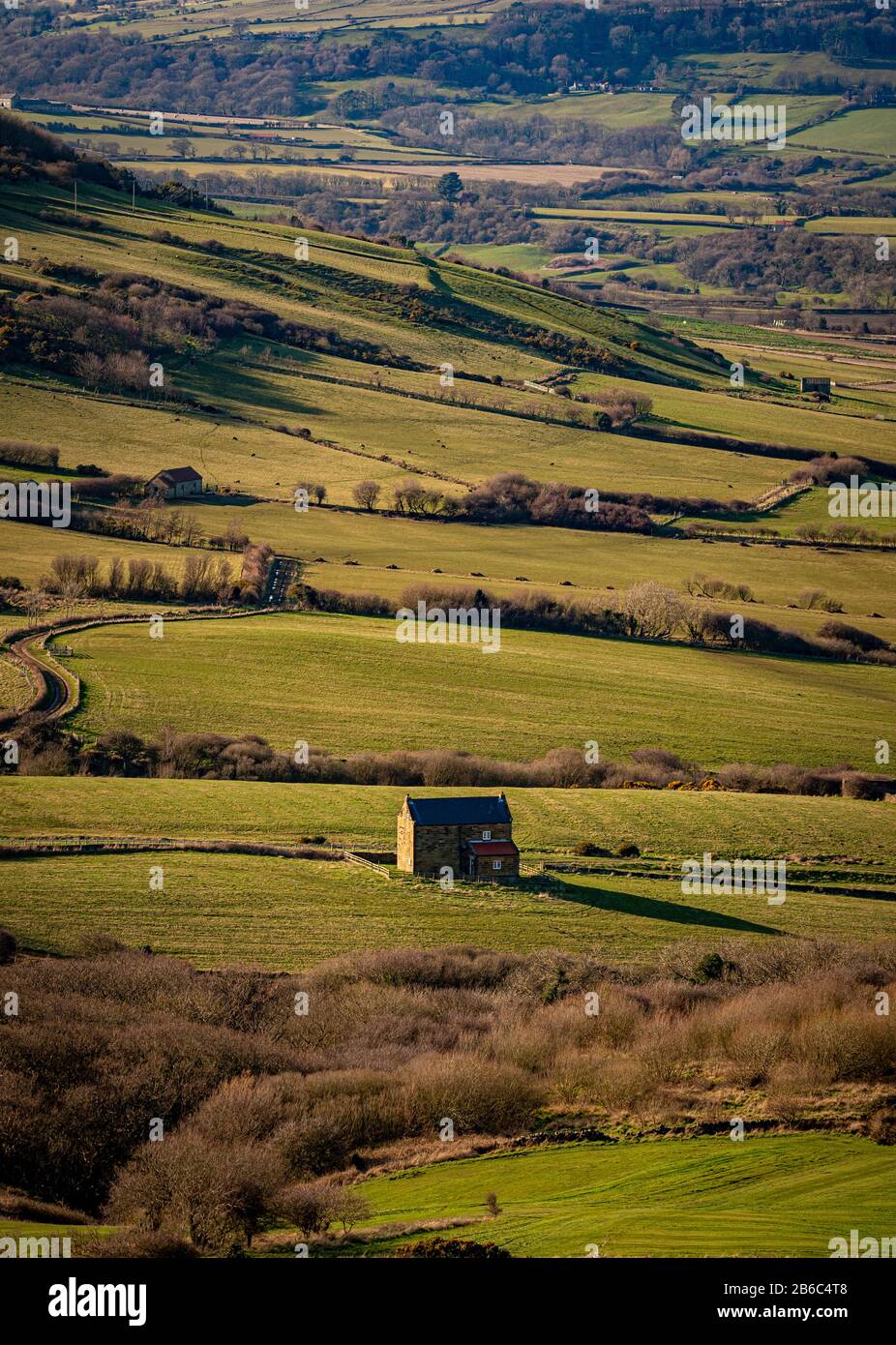 Casa in pietra nel paesaggio, Ravenscar, North Yorkshire, Regno Unito. Foto Stock