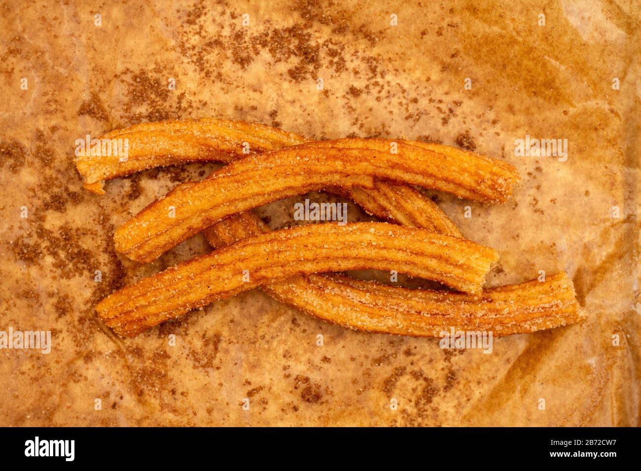 Churros in una carta di mercato Foto Stock
