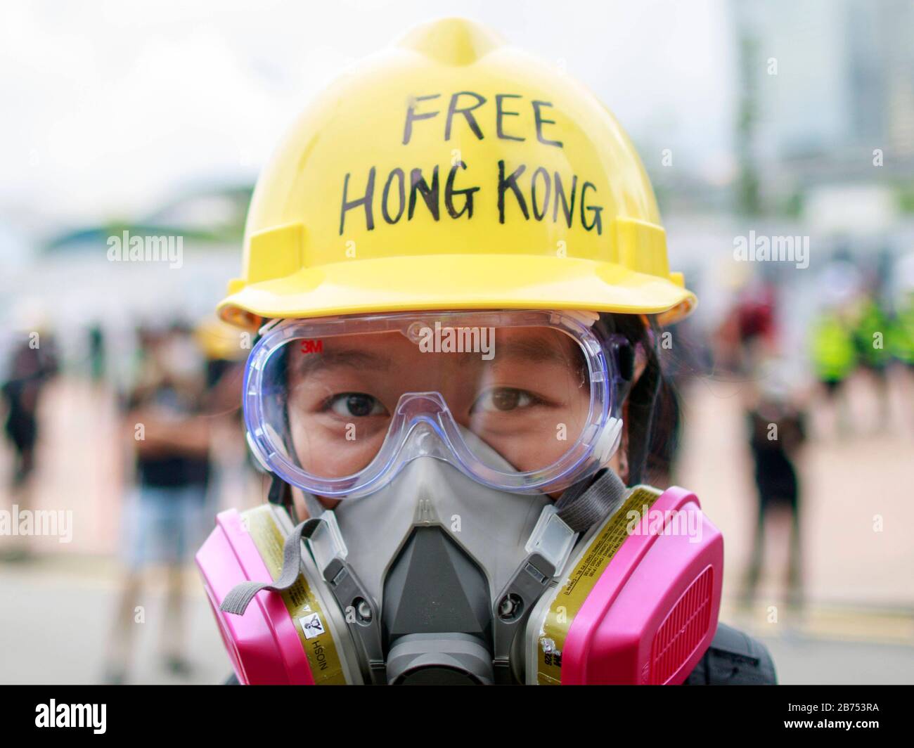 Una protesta anti-governativa femminile. La polizia sopprime i manifestanti anti anti-governativi con violenza a Hong Kong. Foto Stock