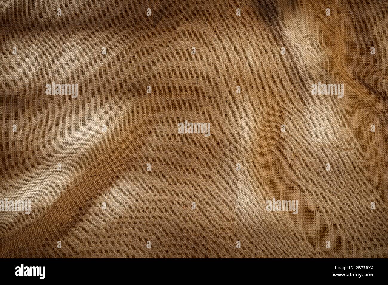 Piatto marrone chiaro beige lino fondo visto dall'alto con spazio copia per la pubblicità di prodotti. Foto Stock