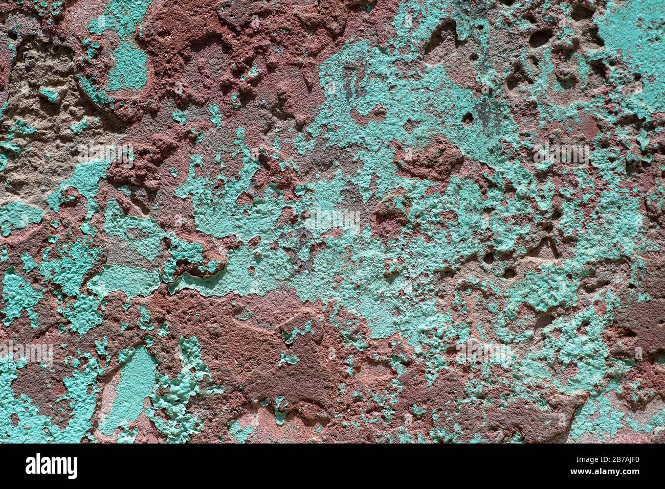 Sfondo astratto di parete testurizzata verde e marrone, primo piano Foto Stock