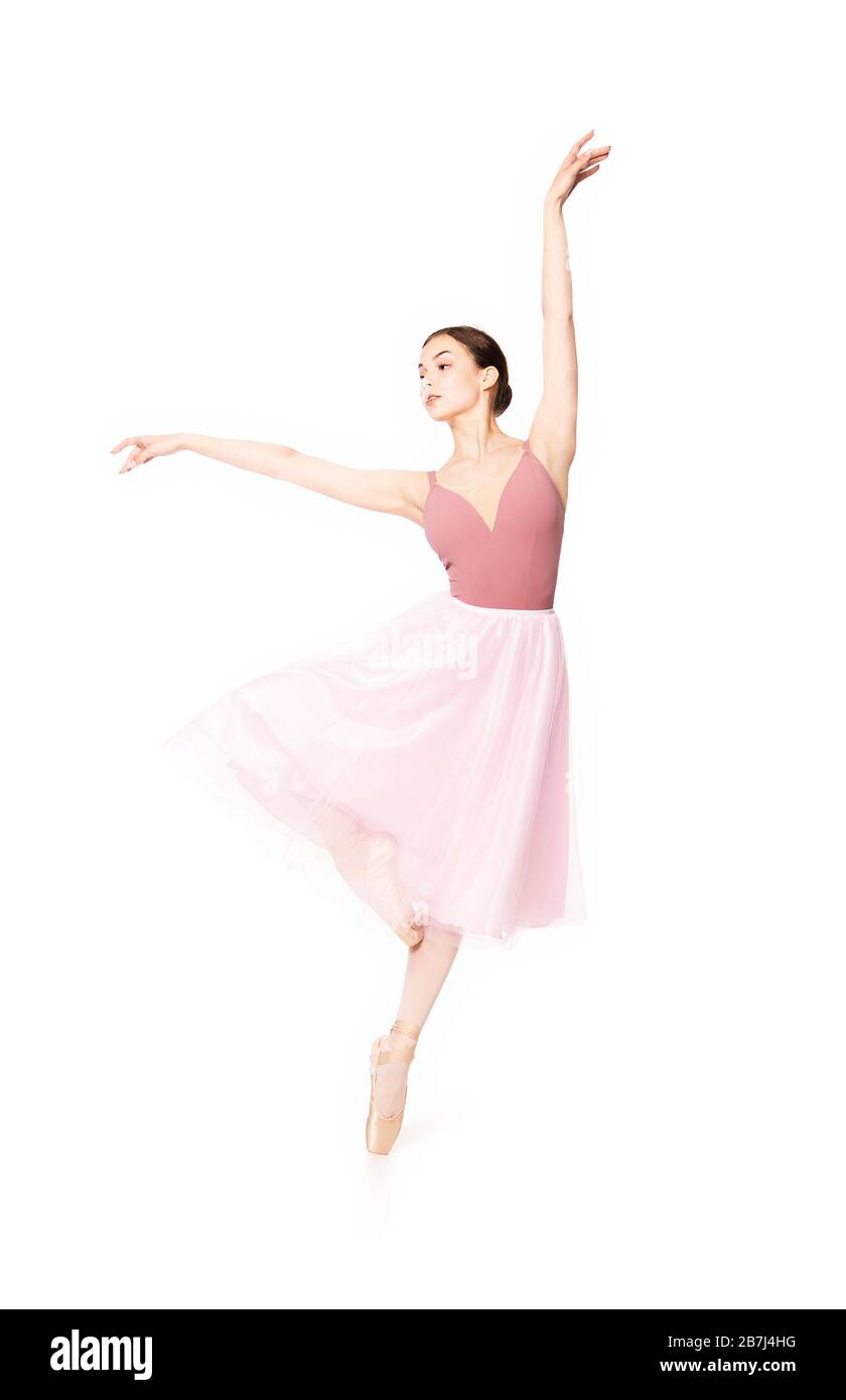 Donna elegante con gonna rosa e balletto beige. Studio su sfondo bianco, immagini isolate. Foto Stock