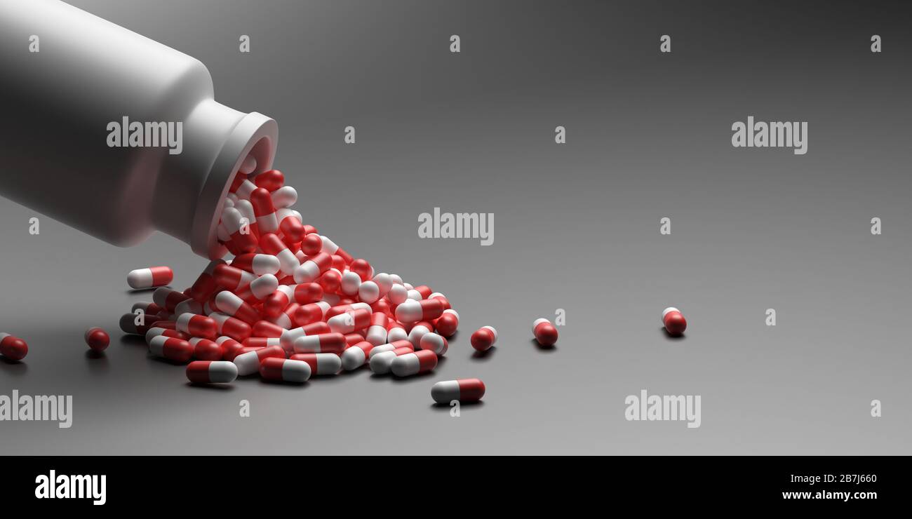 Capsule medicina pillole, salute farmacia concetto. Farmaci per il trattamento di farmaci. Capsule di colore rosso bianco sparse da un flacone su sfondo grigio Foto Stock