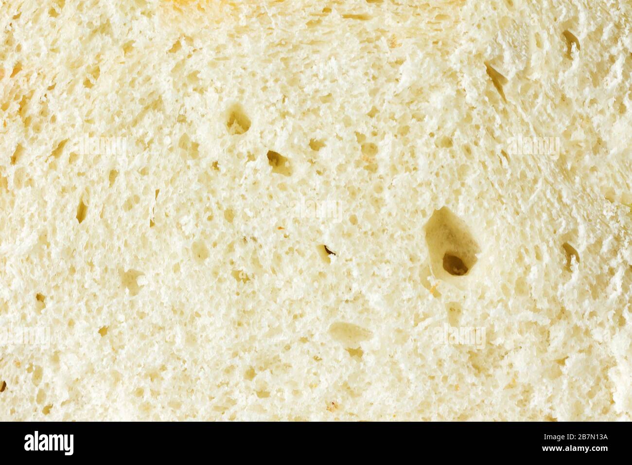 Grana fine-porosa di pane cotto dal primo piano di farina di grano. Foto Stock