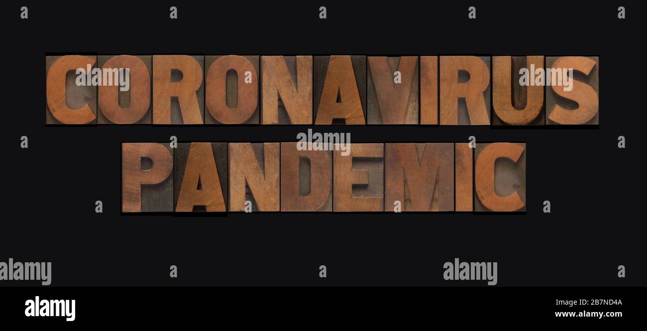 Le parole coronavirus pandemico in lettere di legno di letterpress Foto Stock