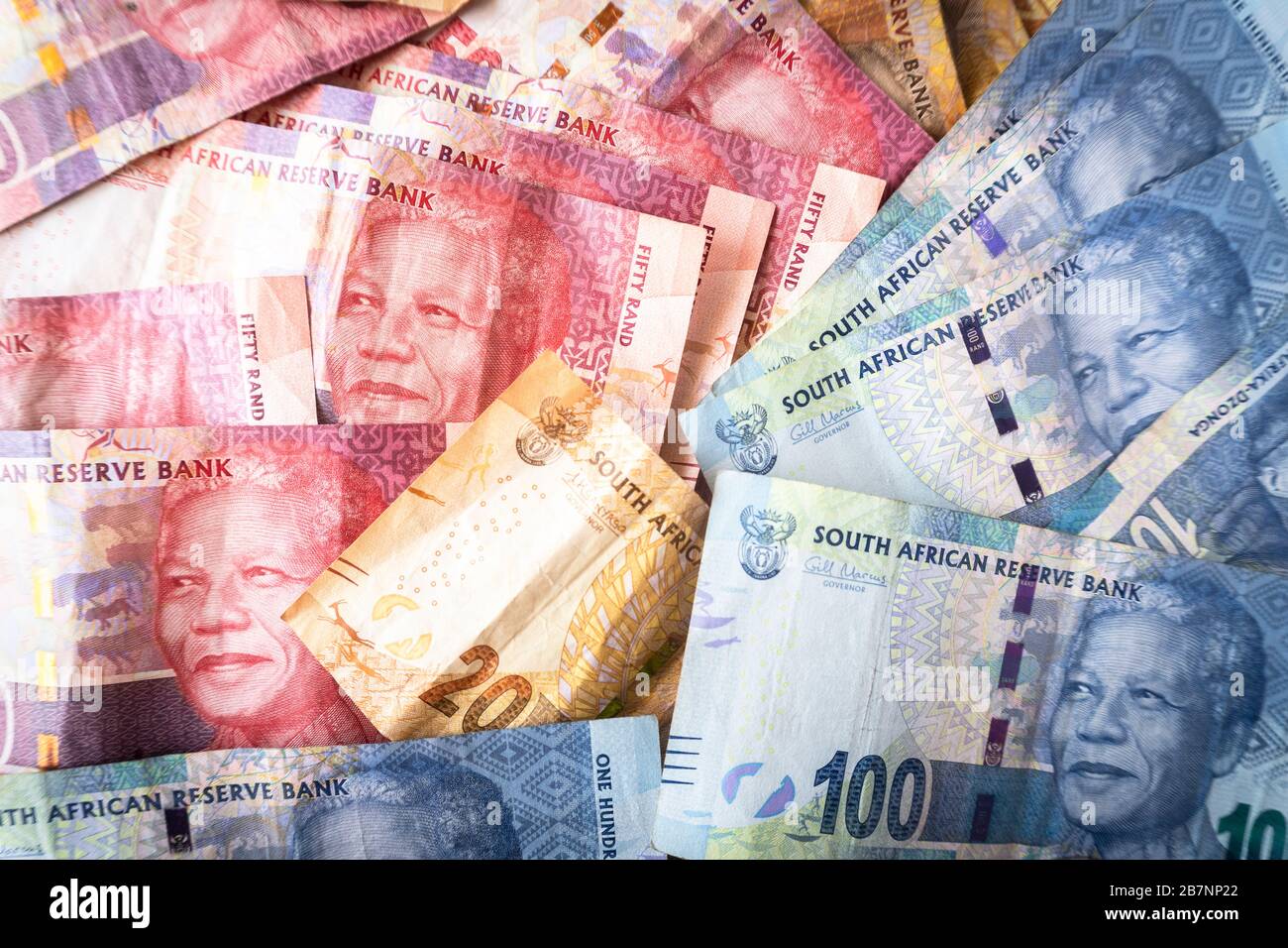 Banconote e monete di valuta sudafricana chiamate Rand Foto Stock