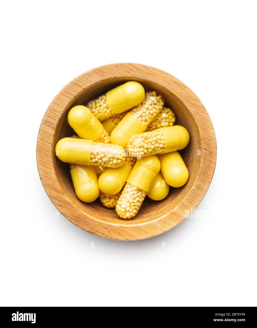 Capsule vitaminiche in ciotola. Pillole di vitamina C isolate su sfondo bianco. Foto Stock