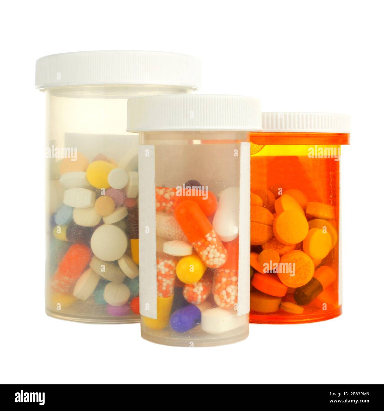 Gruppo di tre flaconi per la medicina riempiti con varie pillole isolate su bianco Foto Stock
