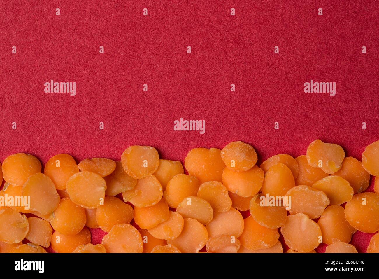 Background close-up lenticchie rosse. Foto Stock