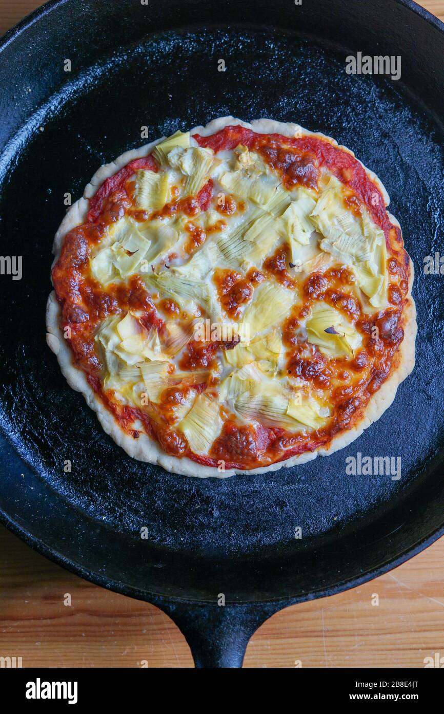 Pizza in ghisa Foto Stock