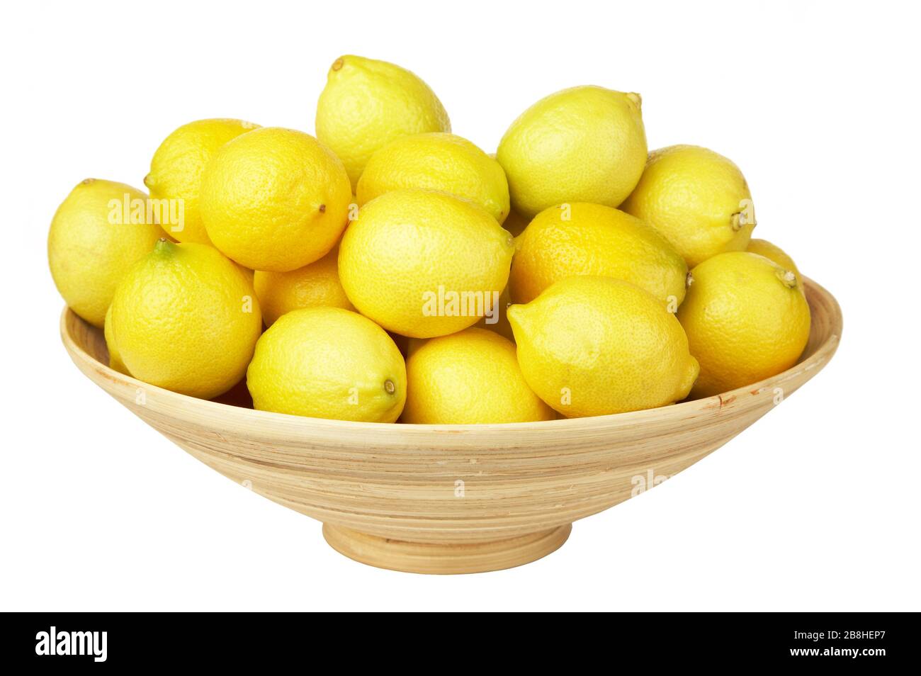 Frutti tropicali nel cesto intrecciato isolato. Üandarins, limoni. Per la progettazione di interni Foto Stock