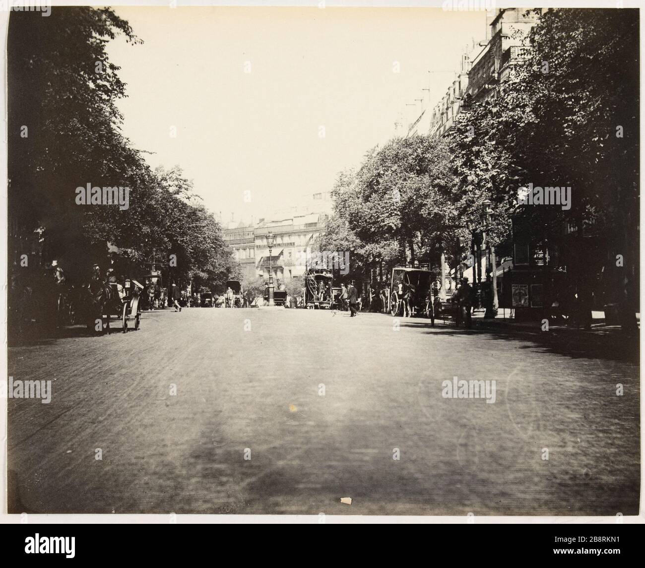 Boulevard Montmartre. Omnibus lontano dal lato della / Bastiglia. Auto a cavallo sul Boulevard Montmartre, 2° e 9° arrondissement, Parigi 'Voitures à cheval sur le boulevard de Montmartre, Parigi (II-IXème arr.)'. Photographie d'Hippolyte Blancard (1843-1924), vers 1890. Parigi, musée Carnavalet. Foto Stock