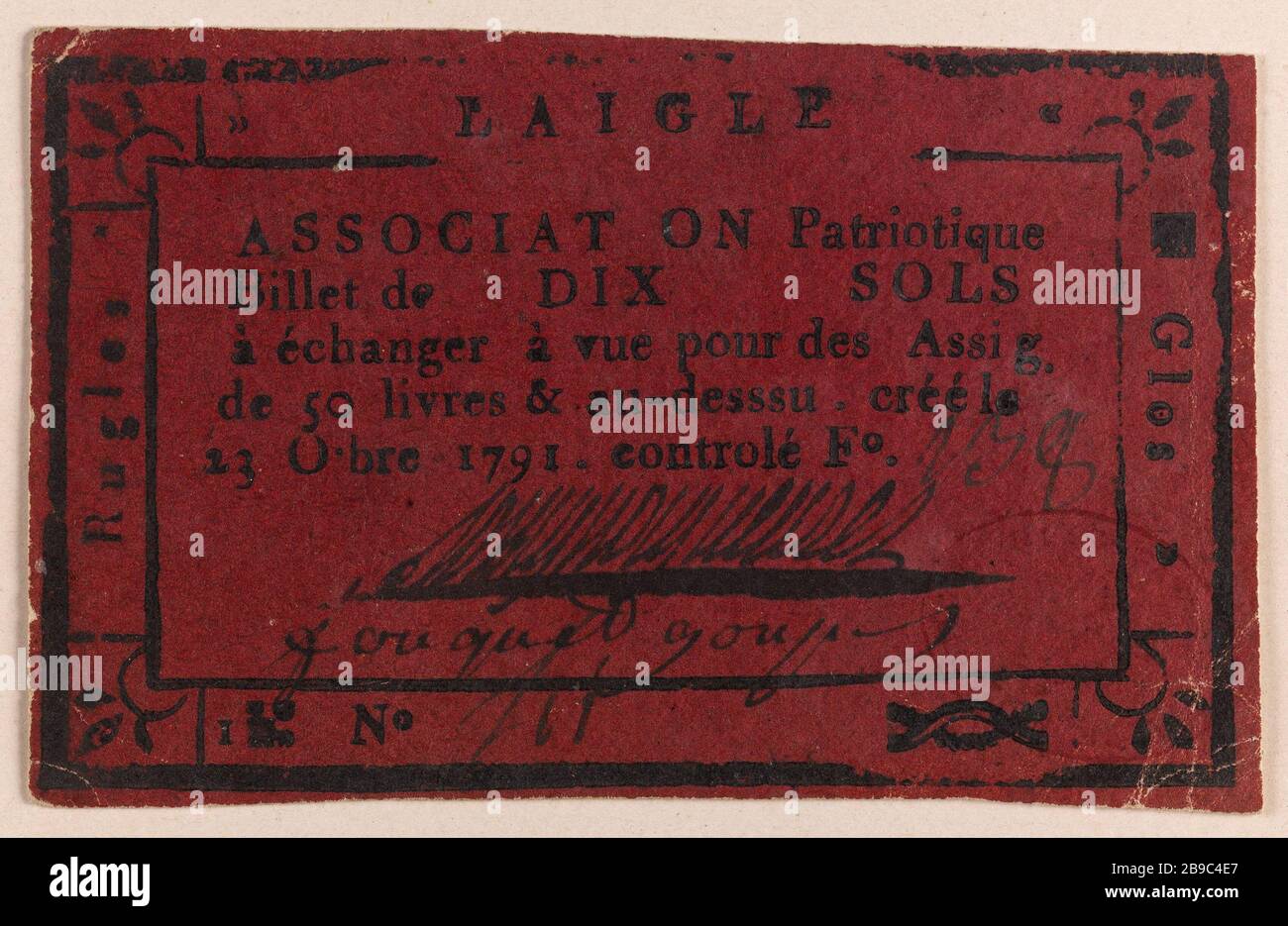 10 nota sotto, Associazione patriottica dell'Aquila, Rugles e Glos, F 238, n° 711, 23 ottobre 1791. Anonyme. Billet de 10 sous, Association patriotique de l'Aigle, Glos et Rugles, F° 238, n° 711, 23 ottobre 1791. Typographie, Encre, papier rouge. 1791. Parigi, musée Carnavalet. Foto Stock