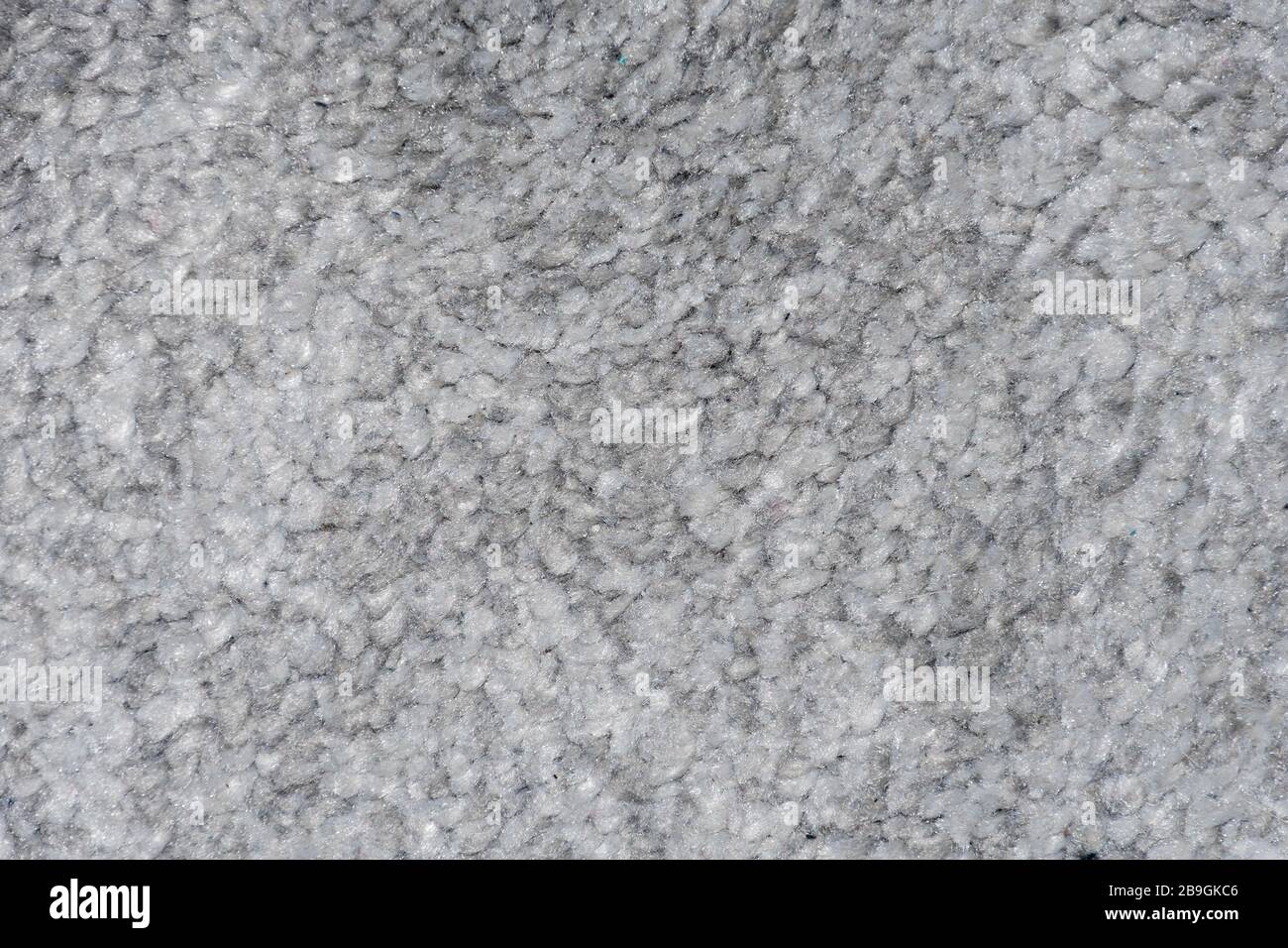 Texture tappeto in diverse tonalità di tessuto sintetico grigio morbido e soffice Foto Stock