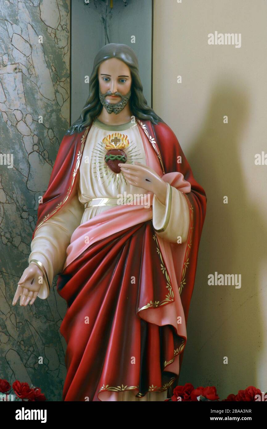 Sacro cuore di Gesù, statua nella Chiesa Parrocchiale del Santo Nome di Maria a Kamanje, Croazia Foto Stock