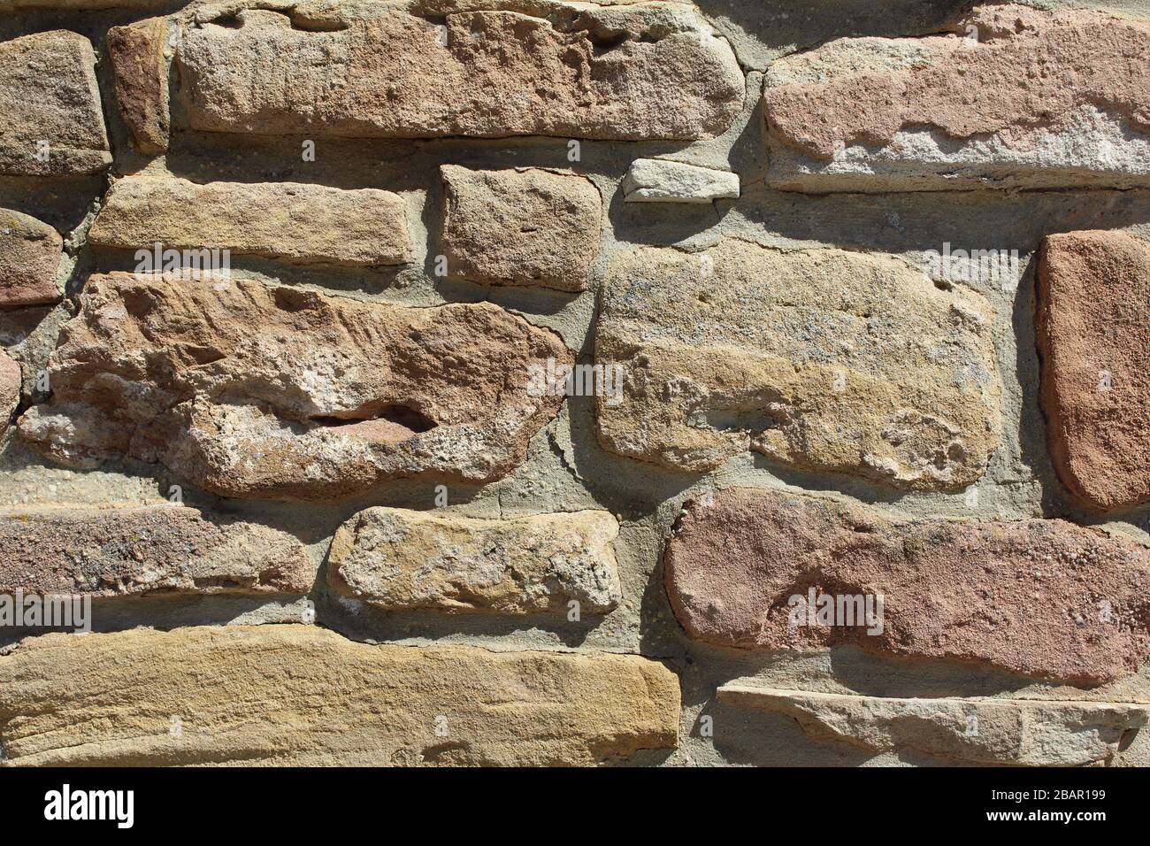 Muro di pietra naturale come una texture di sfondo Foto Stock