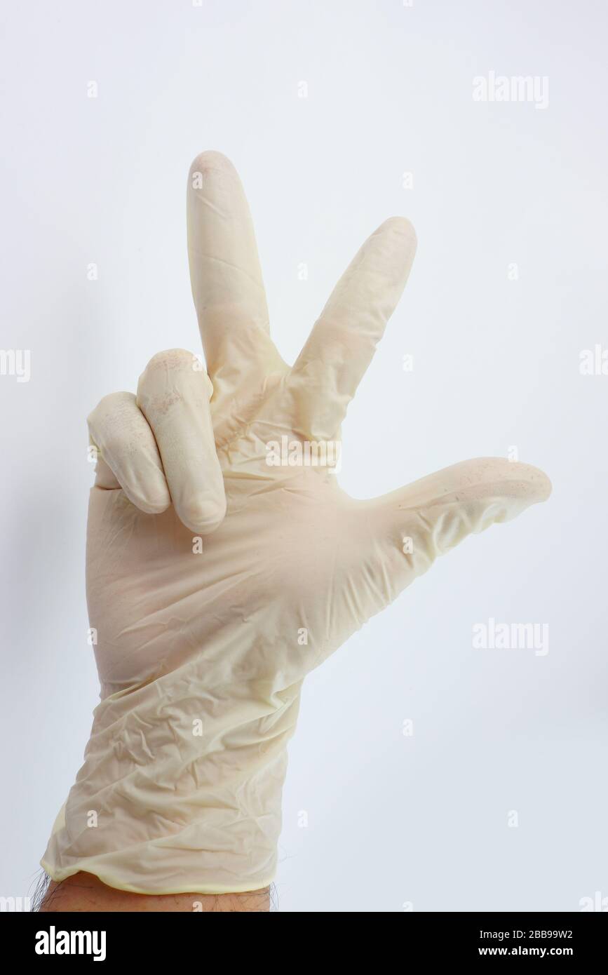 Guanti indossati dal medico per la serie di virus corona Foto Stock
