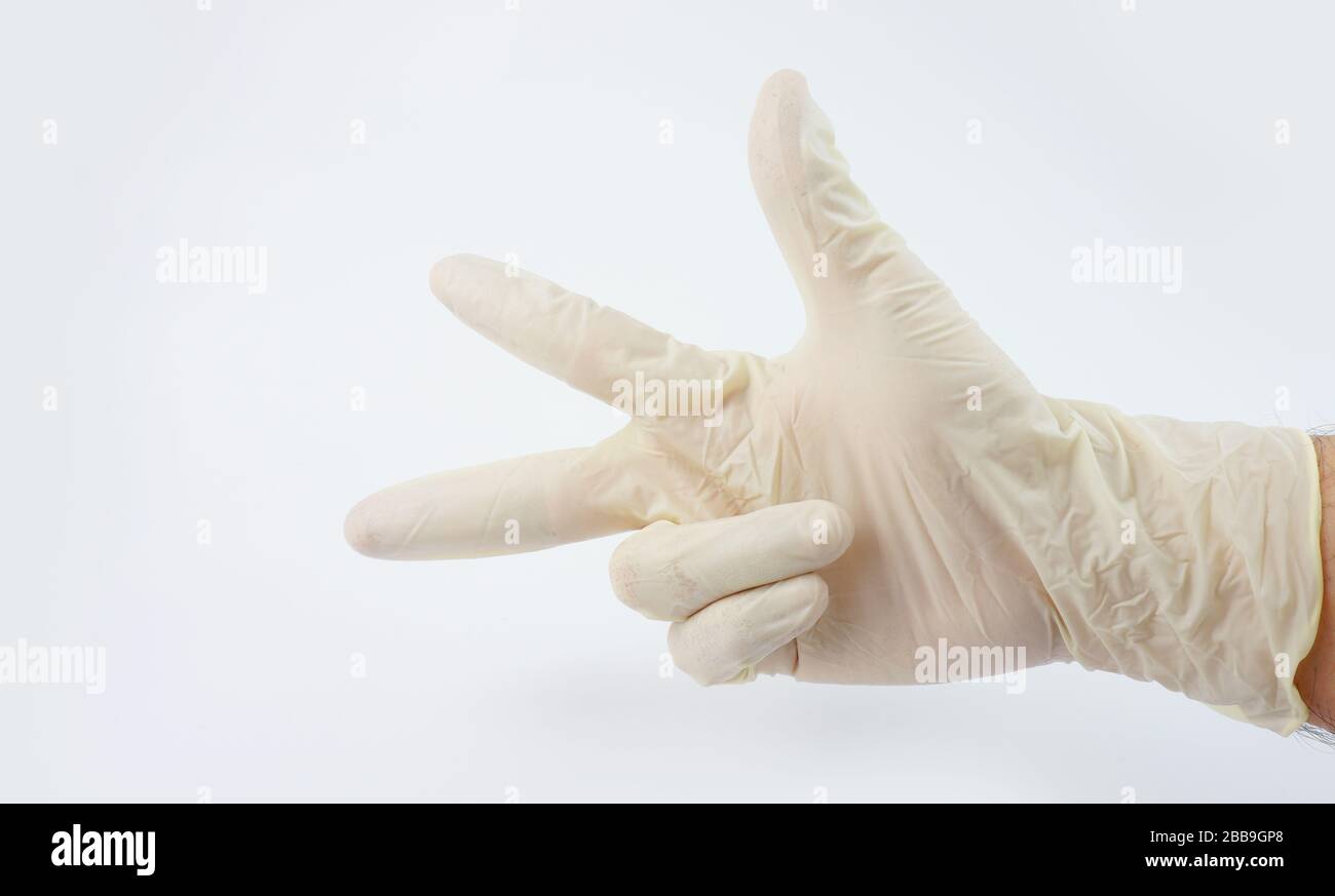 Guanti indossati dal medico per la serie di virus corona Foto Stock