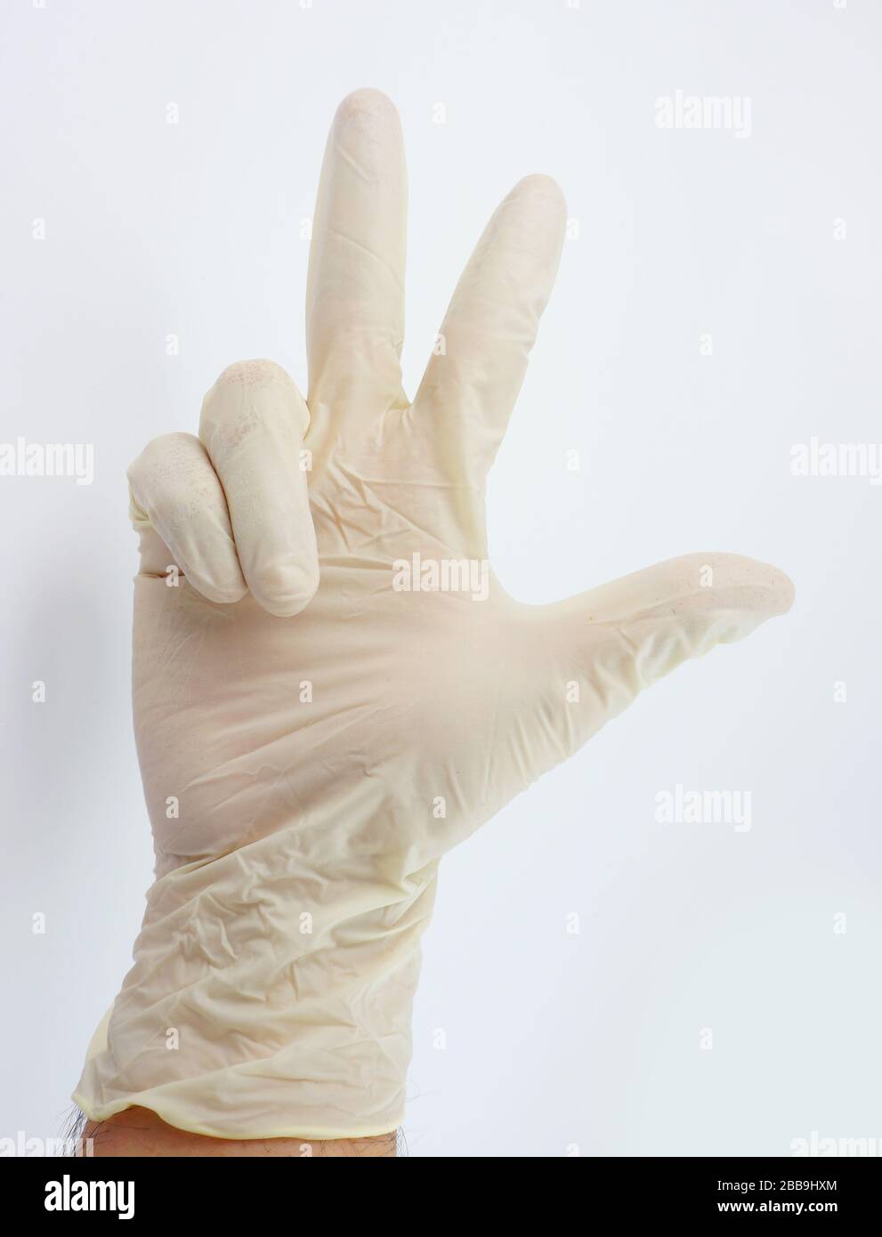 Guanti indossati dal medico per la serie di virus corona Foto Stock