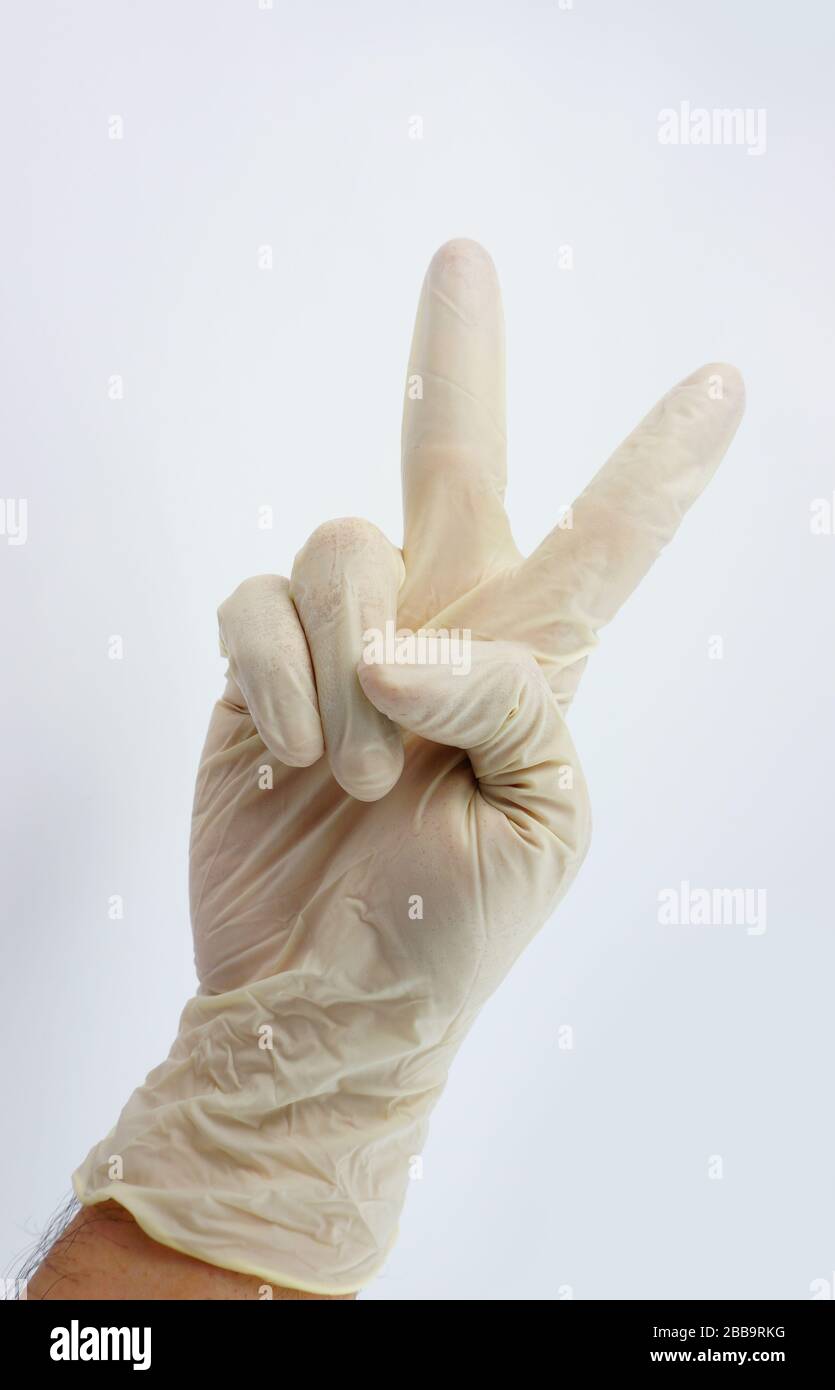 Guanti indossati dal medico per la serie di virus corona Foto Stock