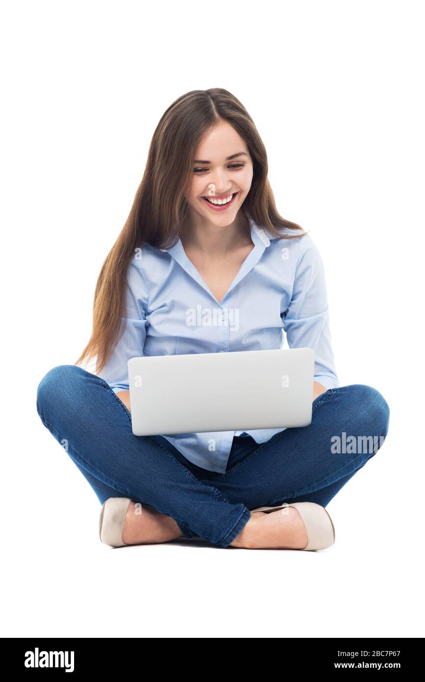 Donna seduta con notebook Foto Stock