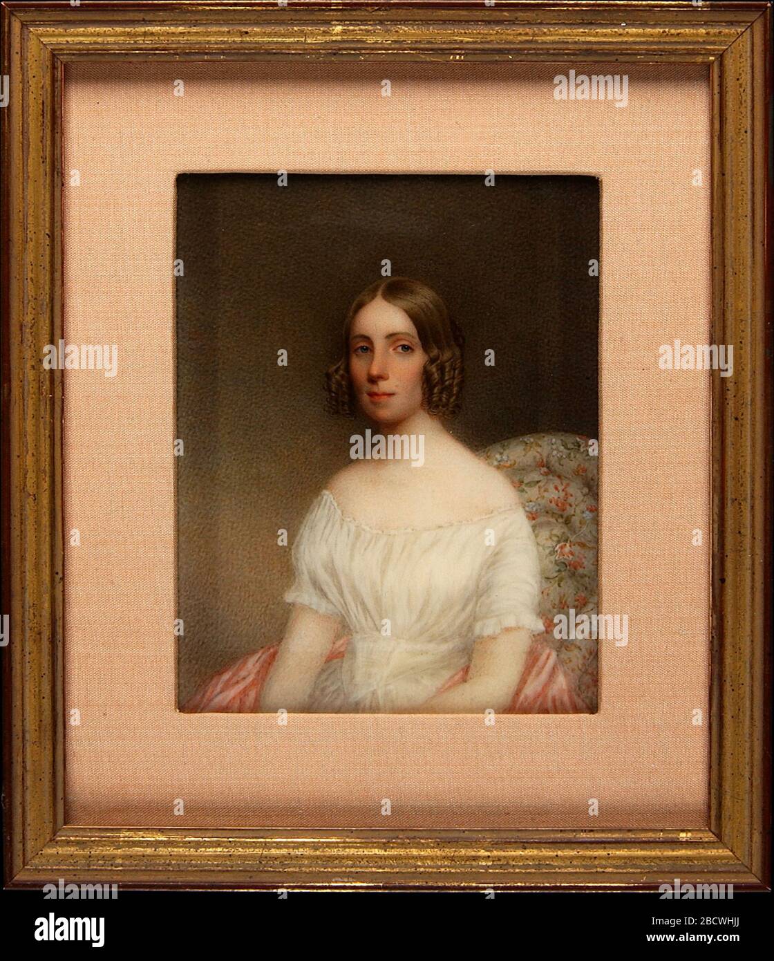Ritratto di una Signora. La giovane donna in questo ritratto indossa una abito tipico della metà-1800s, con un corpetto stretto e appuntito e maniche a spalla. Foto Stock