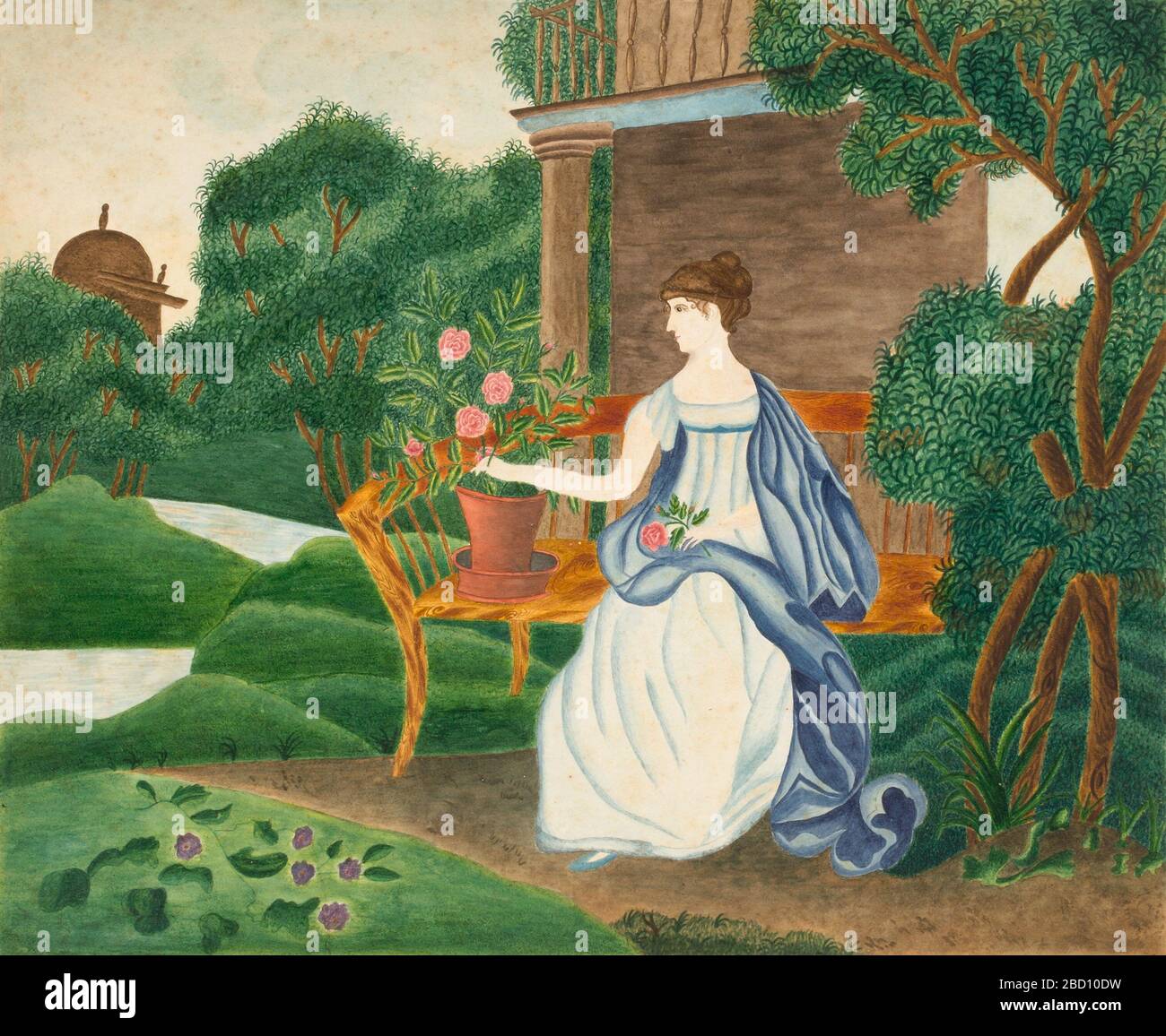 Donna in un giardino. Foto Stock