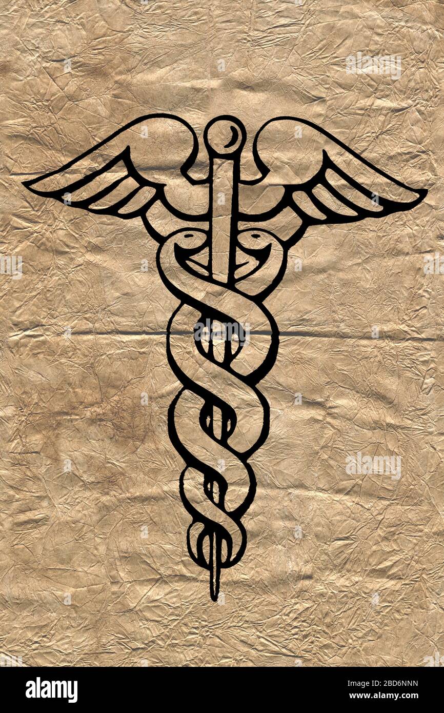 Caduceo simbolo medico su una carta stropicciata molto vecchia. Foto Stock