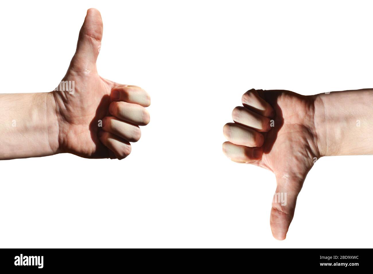 Pollici su/giù, mani, sfondo bianco Foto Stock
