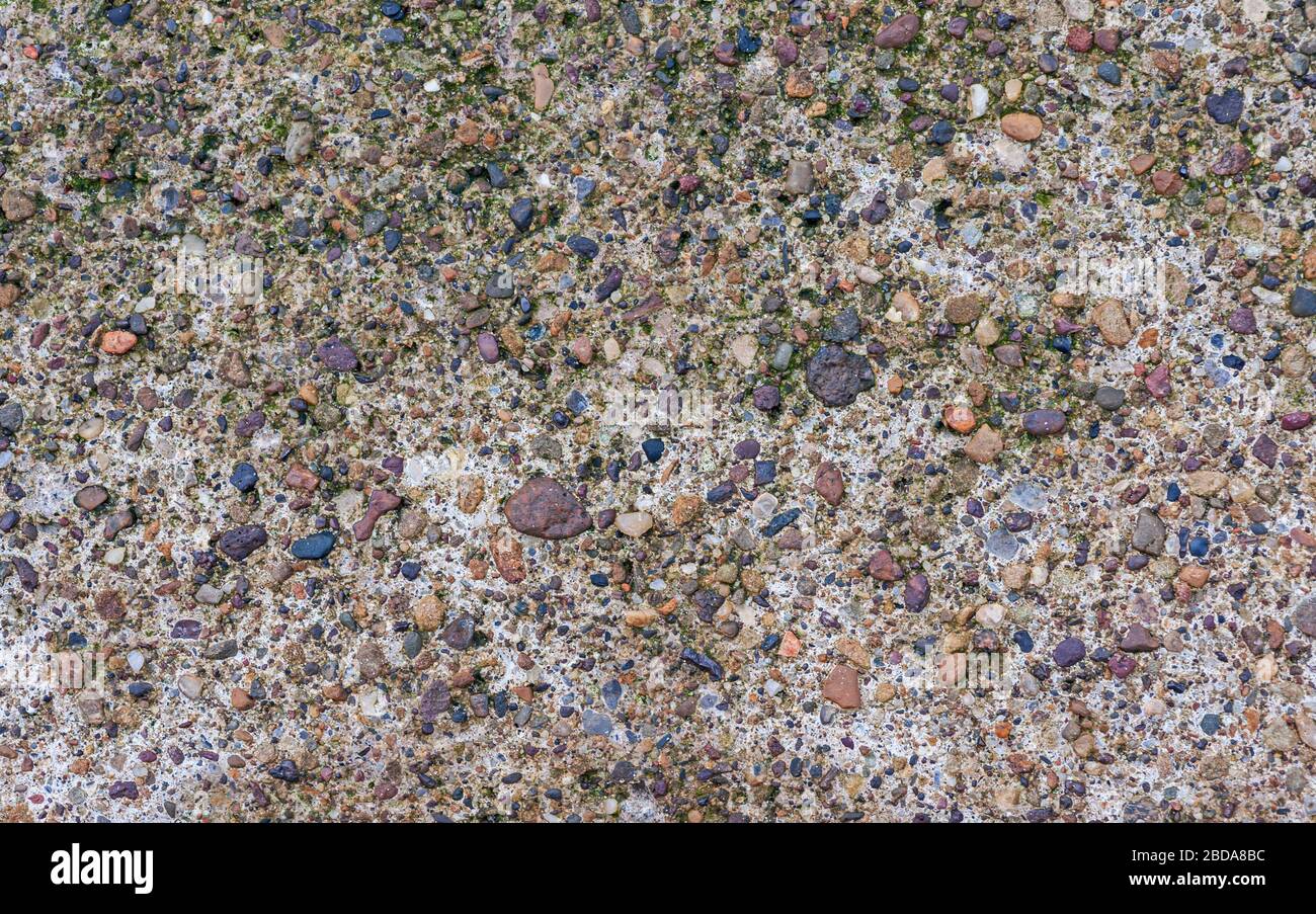 Dettaglio closeup di muro di pietra con ciottoli creazione di sfondo risorsa grafica carta da parati Foto Stock
