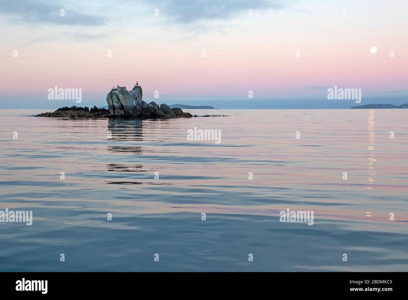 Tramonto sulla Baia di Luna di Miele su Stewart Island Foto Stock