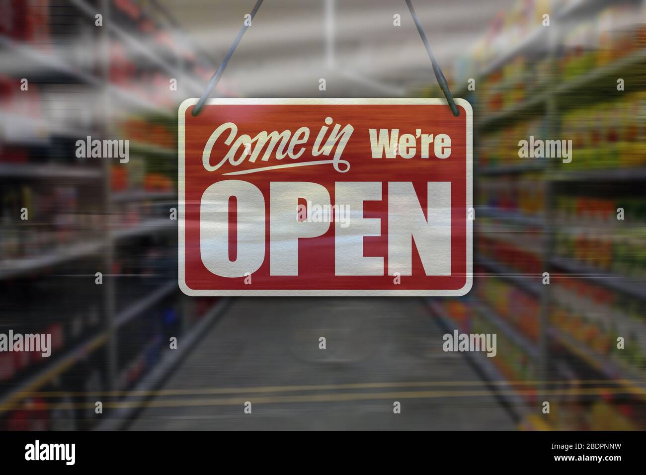 Un segno di affari che dice 'come in We're Open' sul supermercato o la finestra del minimarket. Foto Stock