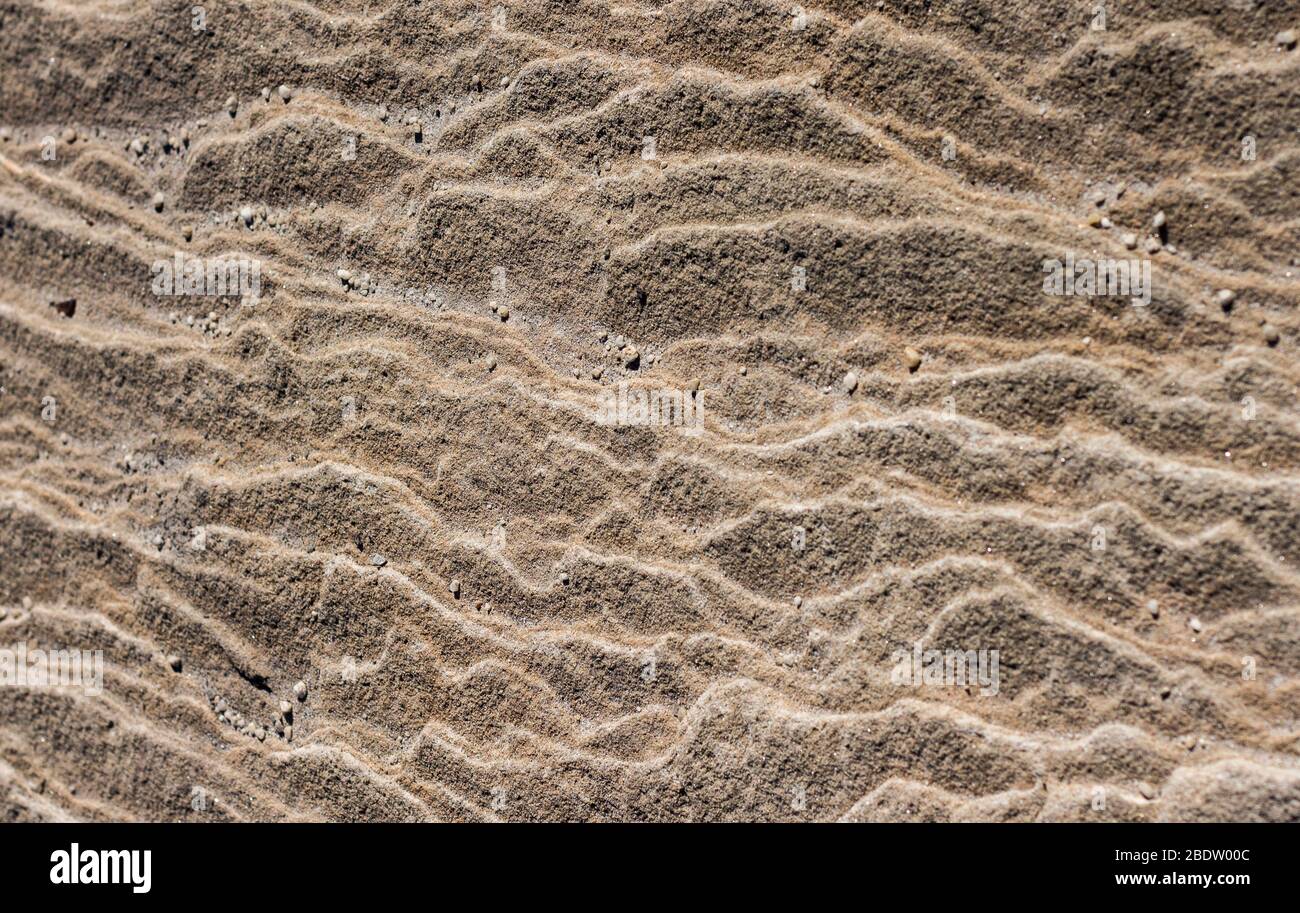 Superficie in pietra arenaria naturale con ondulazione superficie ruvida ideale come sfondo Foto Stock
