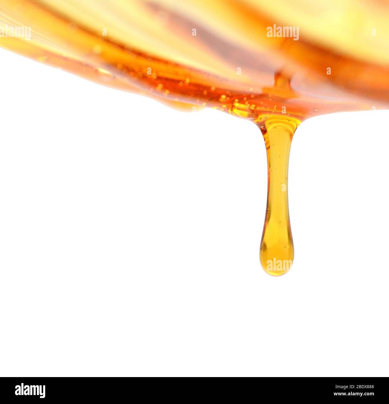 Set di macchie di olio giallo e scende su sfondo bianco Foto Stock