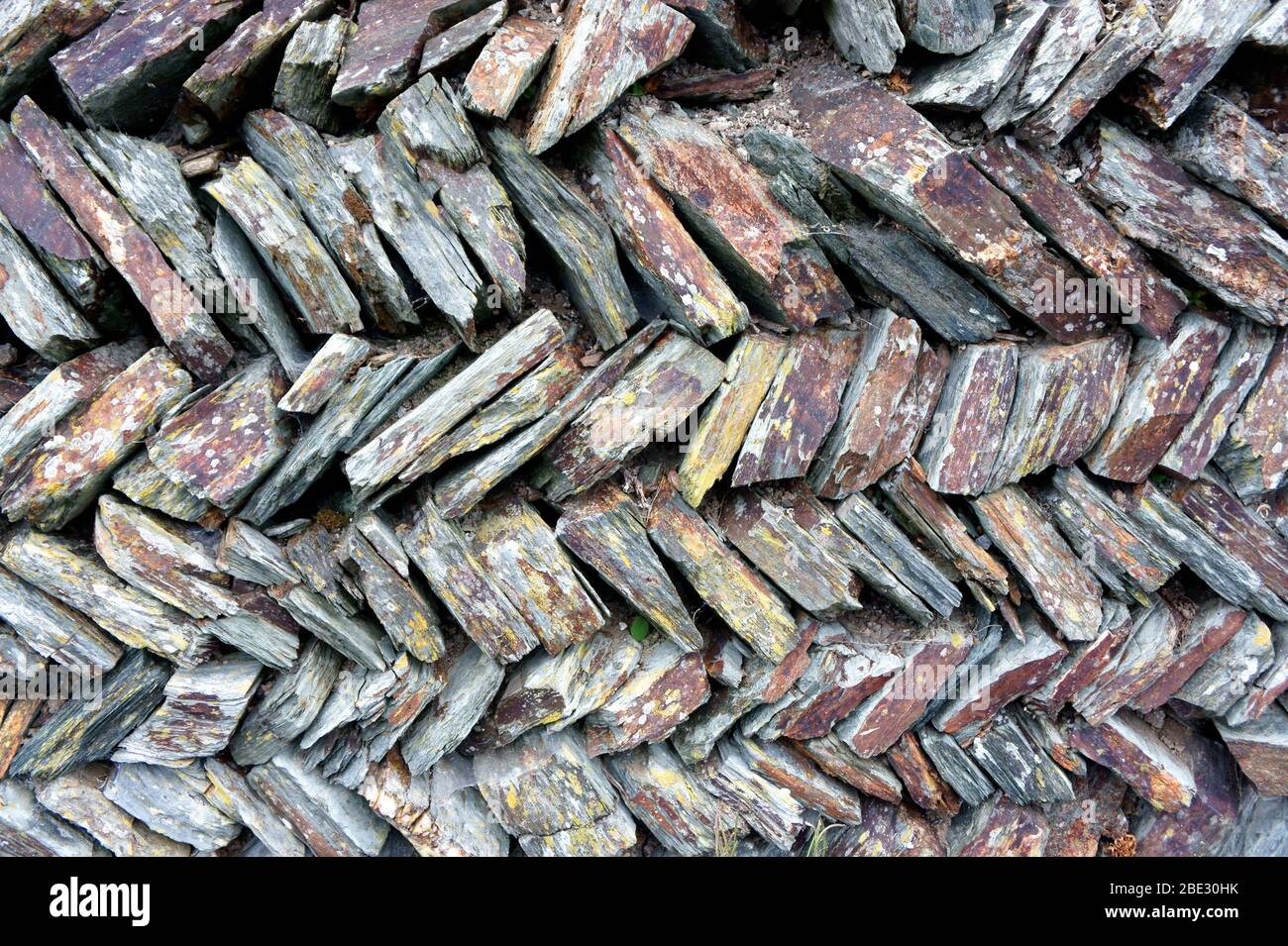 Primo piano del muro di pietra a secco Foto Stock