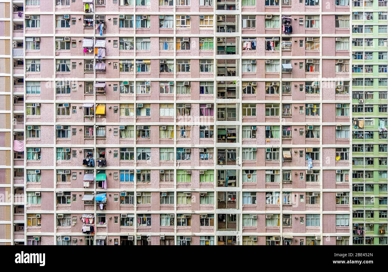 Griglia di stile distopico di alloggi residenziali di alta altezza, Hong Kong Foto Stock