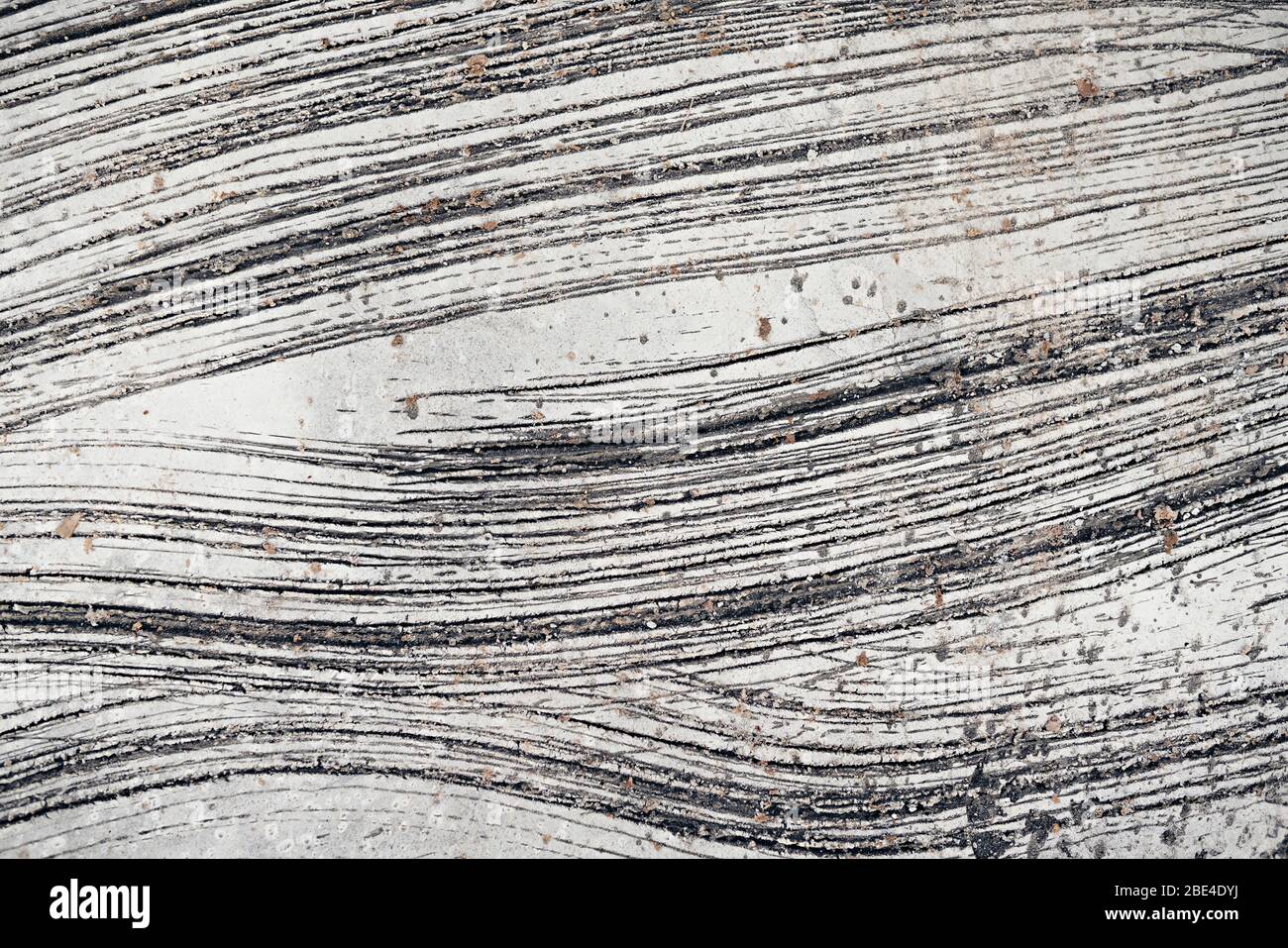 tessitura di fondo muro di cemento con crepe e graffi Foto Stock