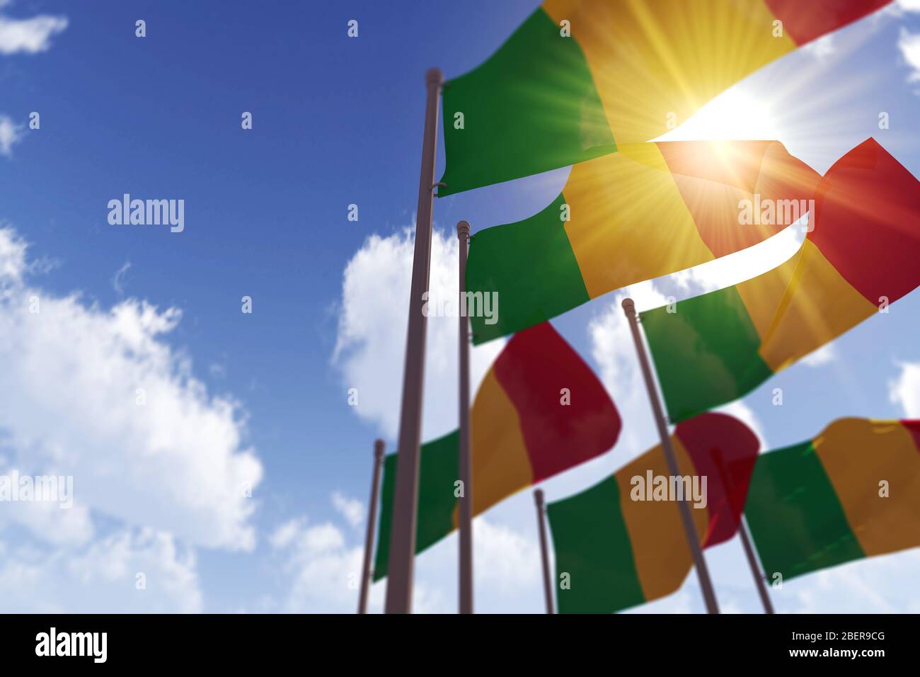 Bandiere del Mali che ondeggiavano nel vento contro un cielo blu. Rendering 3D Foto Stock