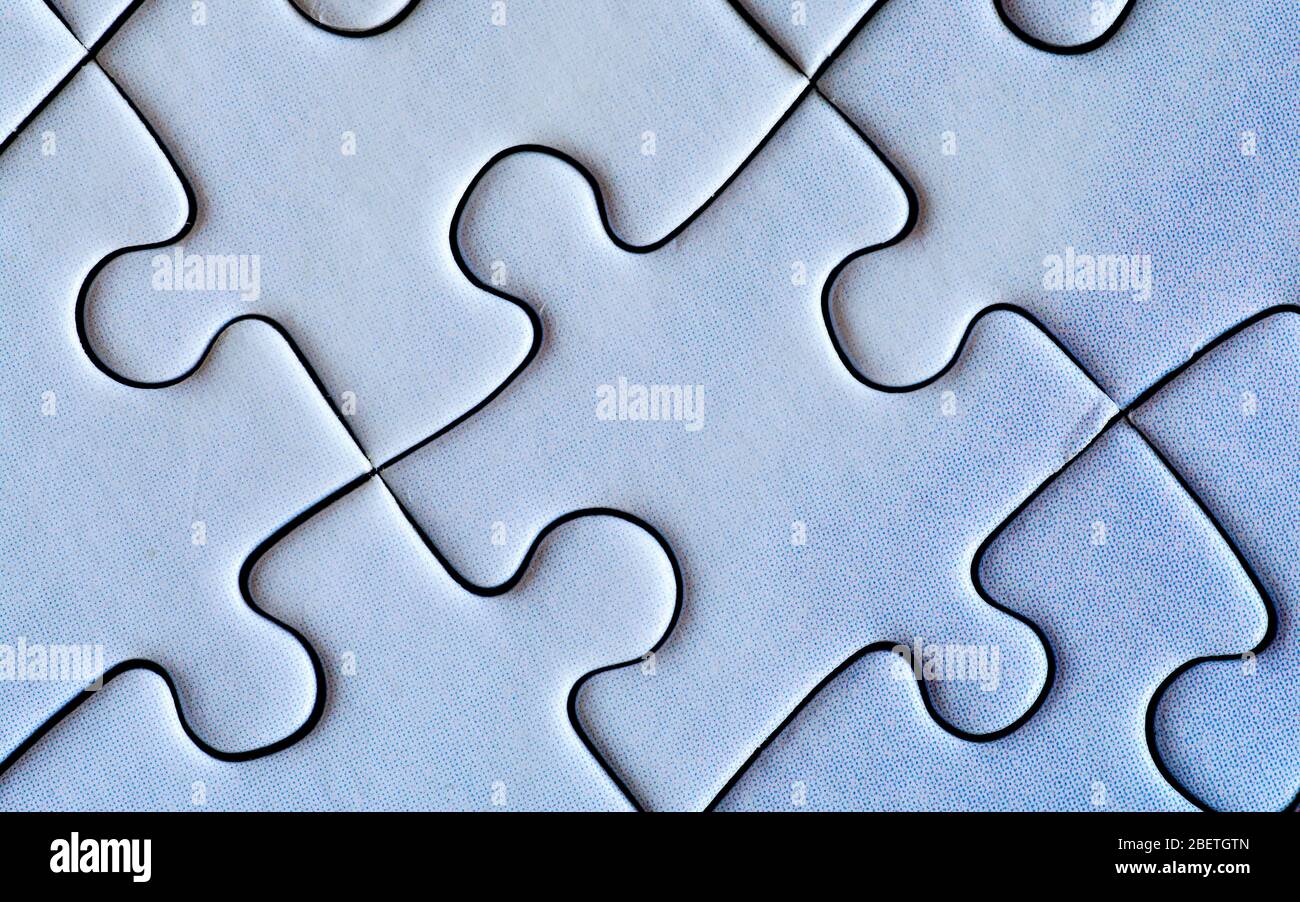 Pezzi di puzzle collegati. Primo piano. Foto Stock