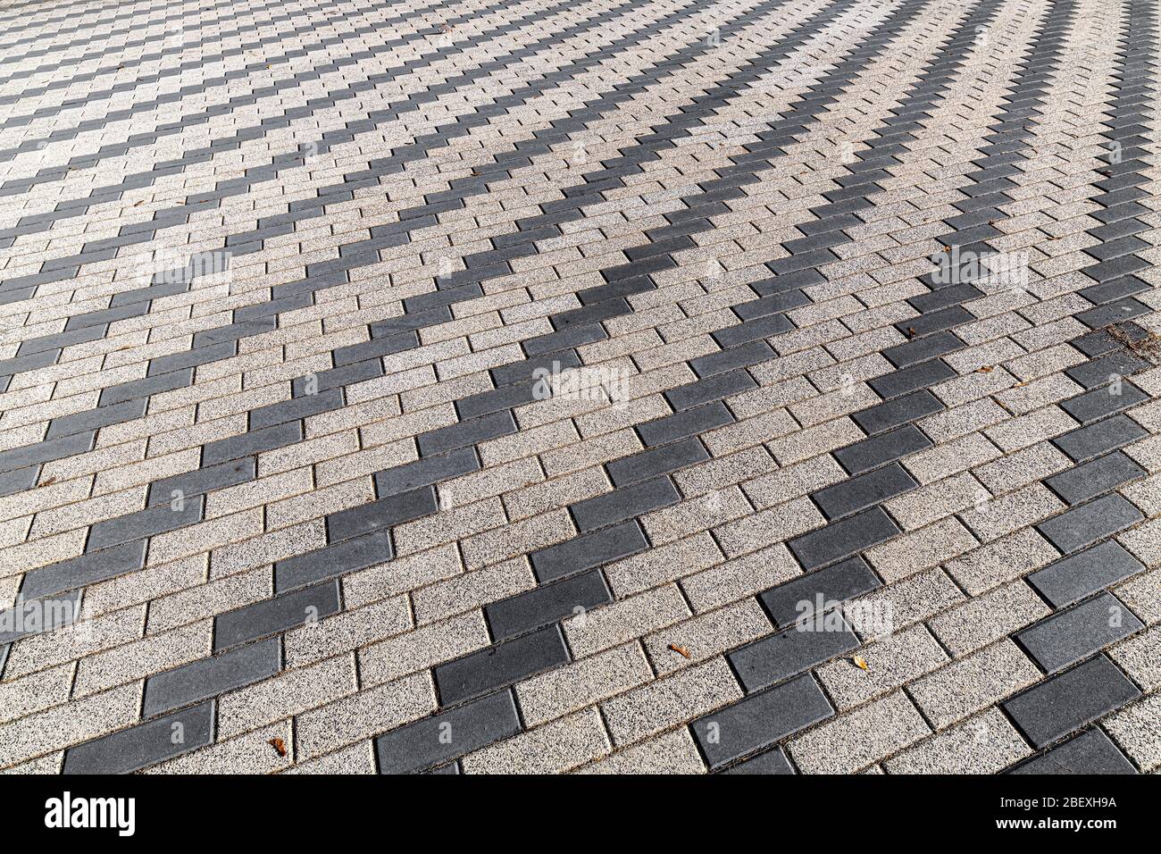 Lo sfondo da una pavimentazione marciapiede grigia Foto Stock