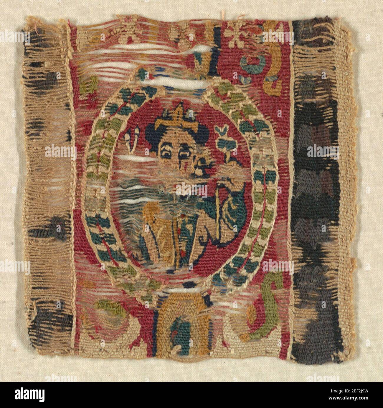 Banda. Cornice ovale contenente una figura che porta qualcosa in mano. Foto Stock