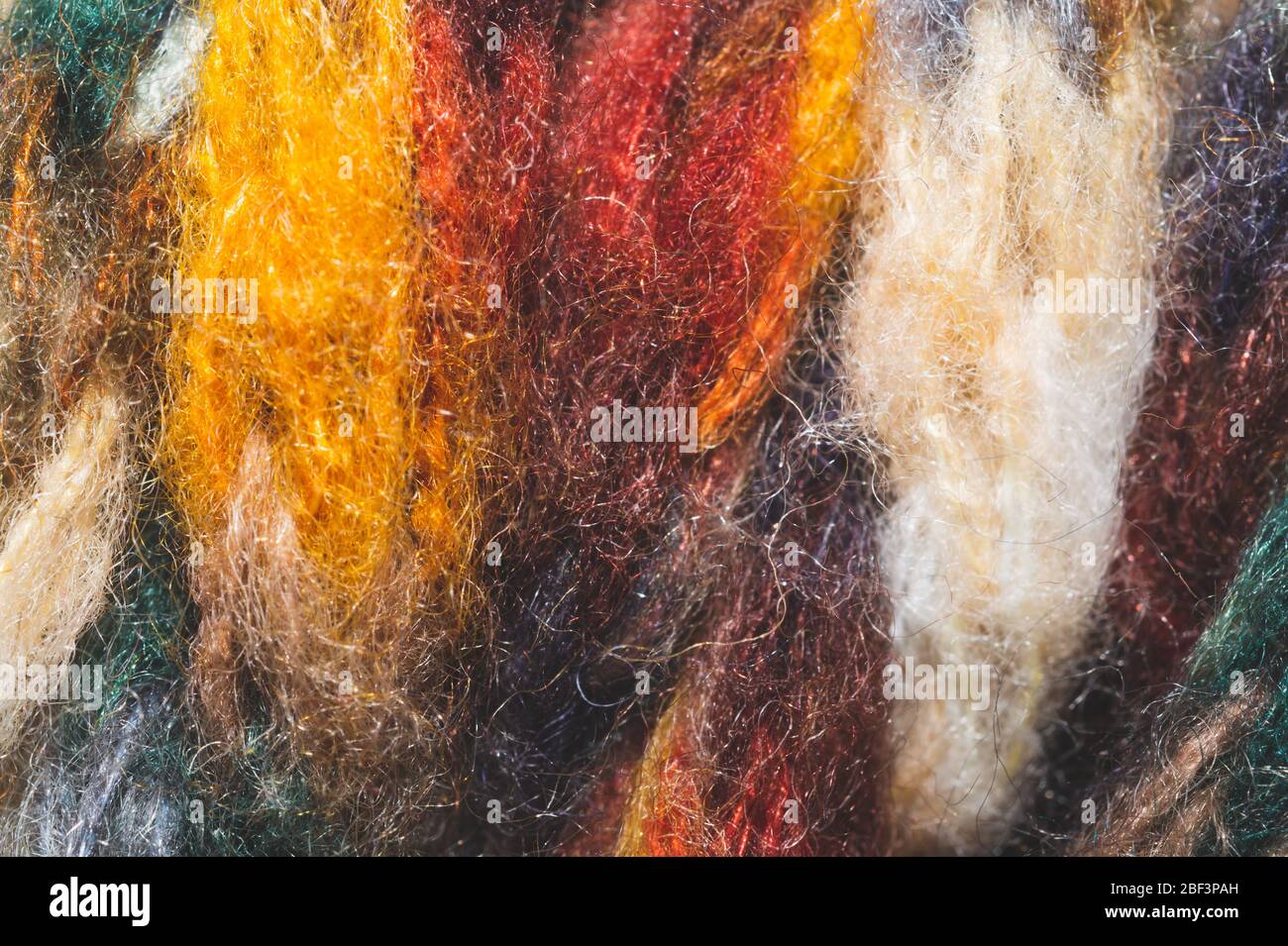 Filato di lana colorato. Tessuto di lana sfondo. Tessuto lavorato a maglia primo piano Foto Stock