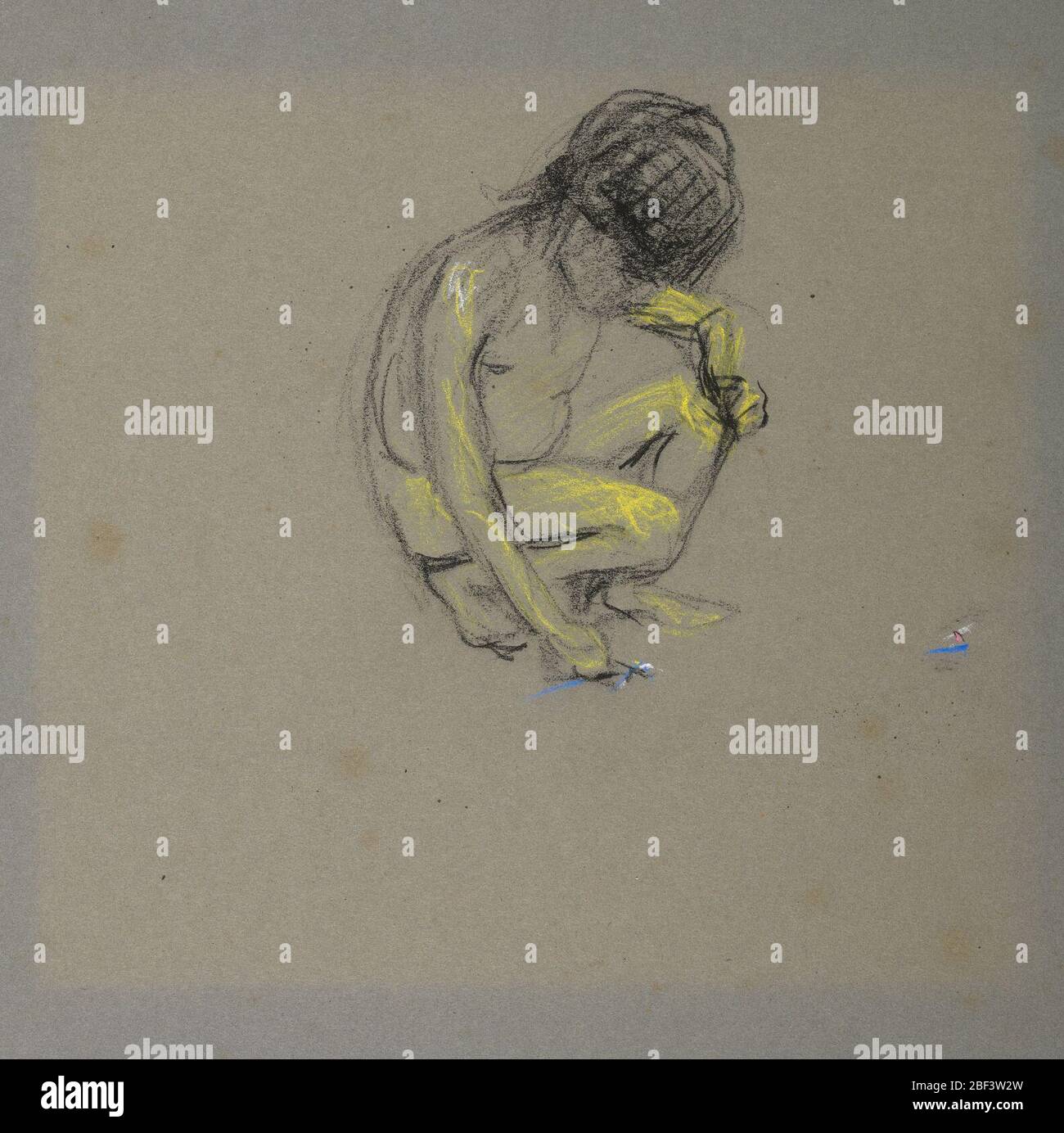 Ragazzo accovacciato. Foto Stock