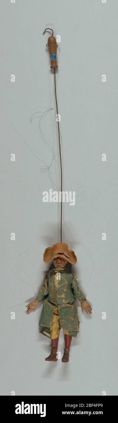 Il Vappo. Set di marionette Commedia dell’arte, ognuna con maschere facciali e costume di carattere stock. Il Vappo è raffigurato con un grande cappello di paglia, una lunga giacca blu e calze rosse. Foto Stock